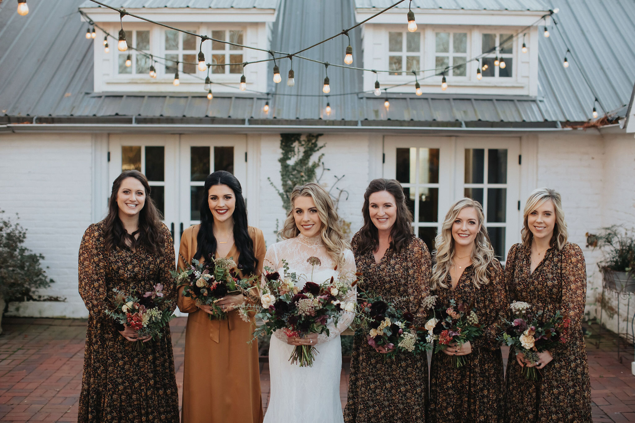 Romantic and earthy bridesmaid's bouquets filled Chocolate Cosmos, Queen Ann's Lace, Baby Eucalyptus, Rust Bunny Tails, Festival Bush, Antique Carnations, Burgundy Ranunculus, and Brown Lisianthus. Designed by Nashville wedding floral designer, Rose…