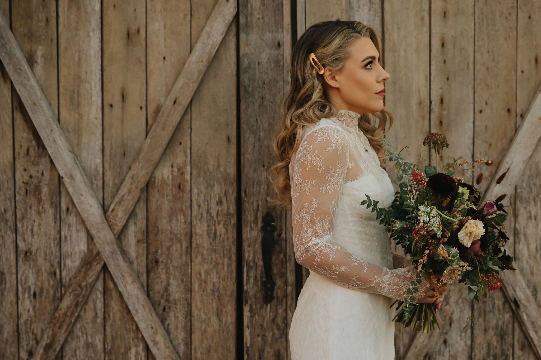 A perfect botanical and moody Bridal bouquet filled with Chocolate Cosmos, Queen Ann's Lace, Baby Eucalyptus, Rust Bunny Tails, Festival Bush, Antique Carnations, Burgundy Ranunculus, and Brown Lisianthus. Designed by Nashville wedding floral design…