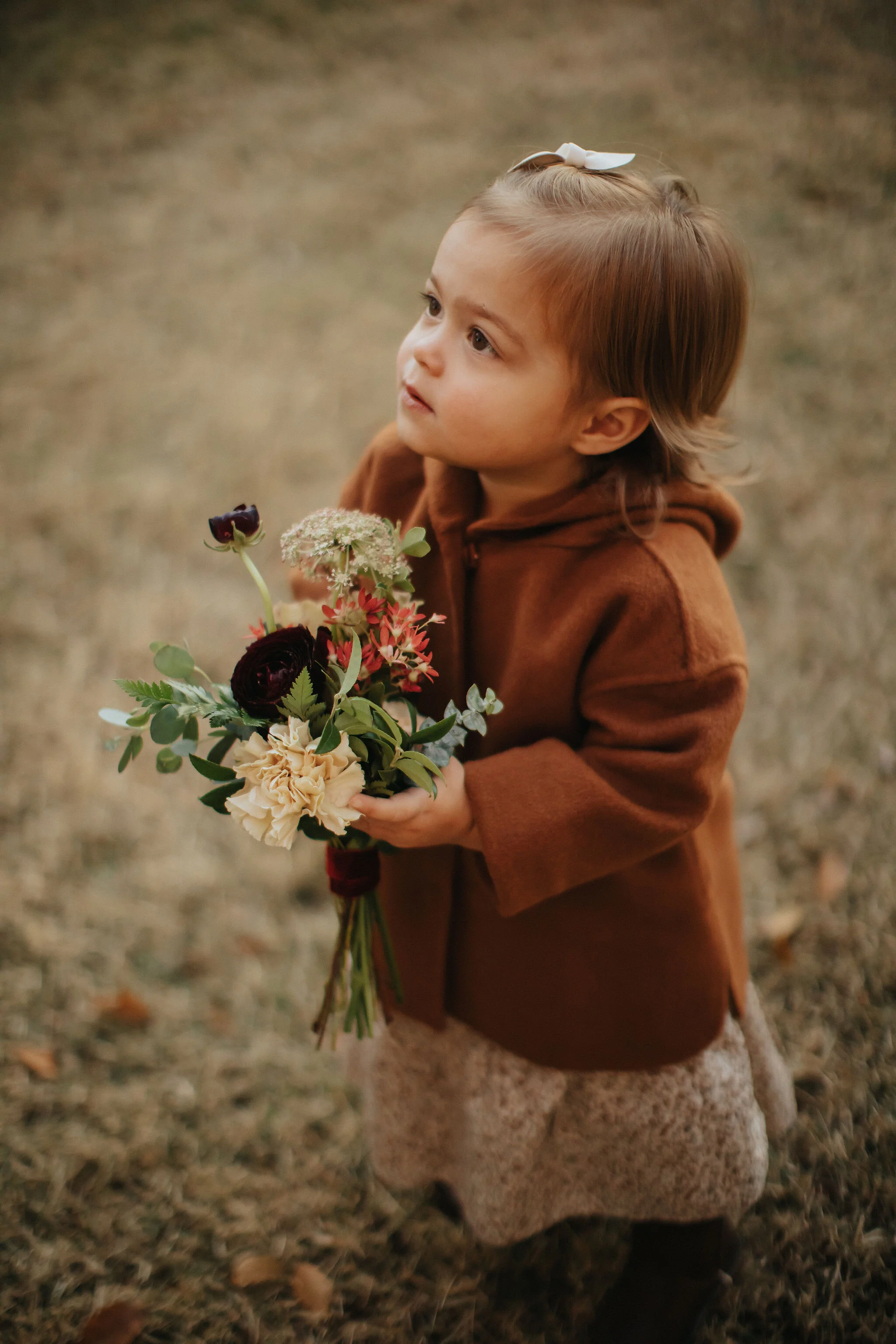 Romantic and earthy bridesmaid's bouquets filled Chocolate Cosmos, Queen Ann's Lace, Baby Eucalyptus, Rust Bunny Tails, Festival Bush, Antique Carnations, Burgundy Ranunculus, and Brown Lisianthus. Designed by Nashville wedding floral designer, Rose…