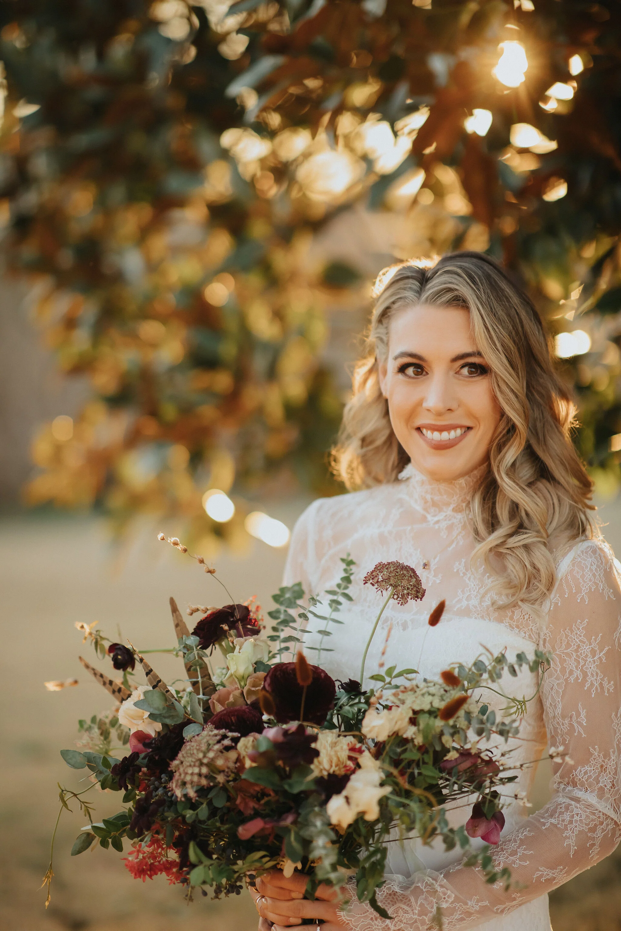 A perfect botanical and moody Bridal bouquet filled with Chocolate Cosmos, Queen Ann's Lace, Baby Eucalyptus, Rust Bunny Tails, Festival Bush, Antique Carnations, Burgundy Ranunculus, and Brown Lisianthus. Designed by Nashville wedding floral design…