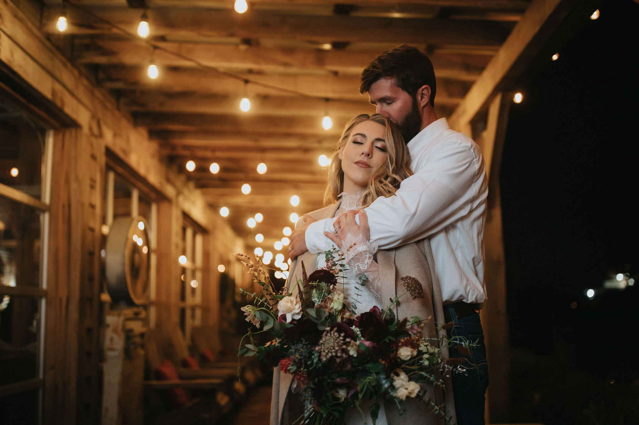 A perfect botanical and moody Bridal bouquet filled with Chocolate Cosmos, Queen Ann's Lace, Baby Eucalyptus, Rust Bunny Tails, Festival Bush, Antique Carnations, Burgundy Ranunculus, and Brown Lisianthus. Designed by Nashville wedding floral design…