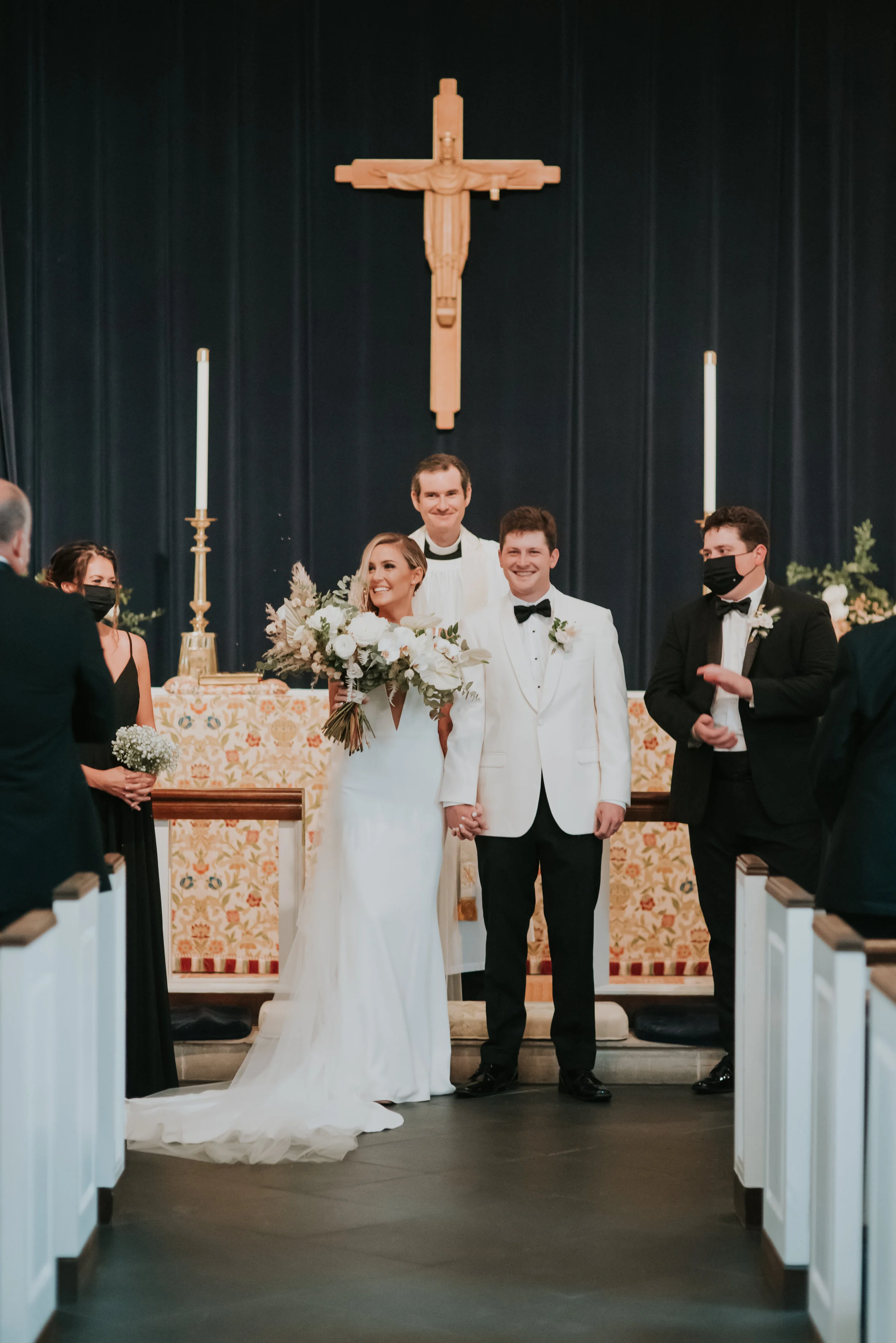 Bohemian and modern yet classically elegant. This Bridal bouquet perfectly married boho elements of pampas grass, eucalyptus, and dried florals with topical stems of anthurium, orchid and ranunculus for a fresh take on white. Designed by Nashville w…