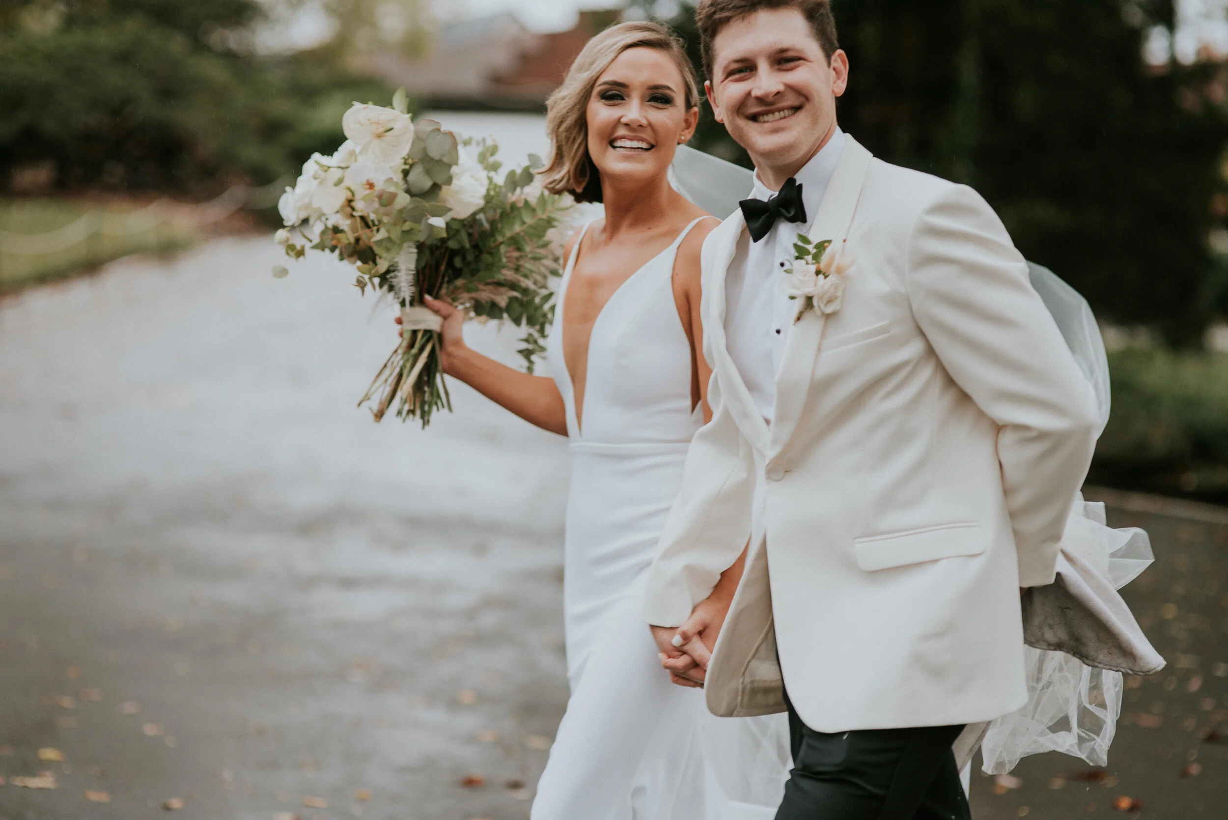 Bohemian and modern yet classically elegant. This Bridal bouquet perfectly married boho elements of pampas grass, eucalyptus, and dried florals with topical stems of anthurium, orchid and ranunculus for a fresh take on white. Designed by Nashville w…