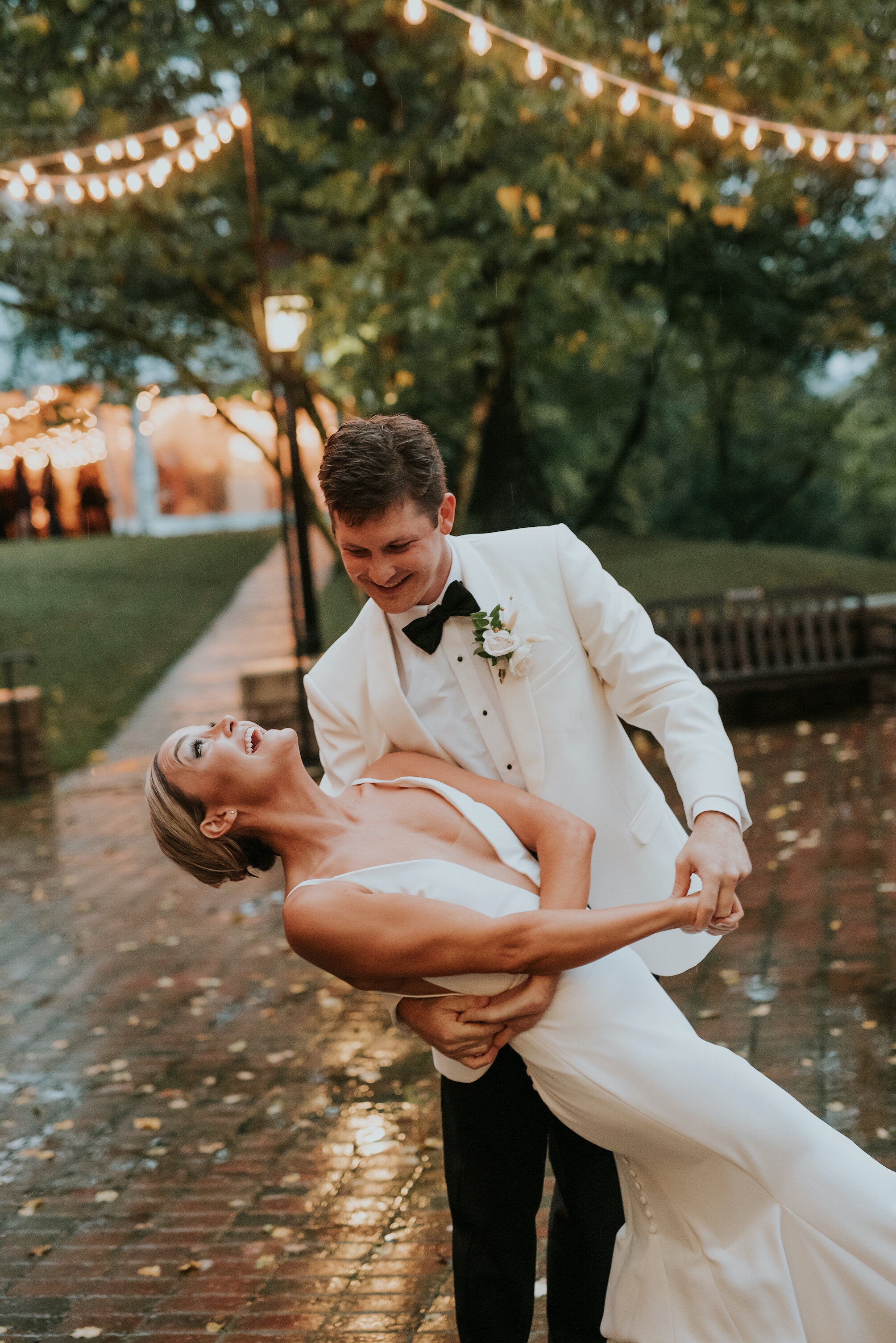 Bohemian and modern yet classically elegant. This wedding perfectly married boho elements of pampas grass, eucalyptus, and dried florals with topical stems of anthurium and orchid. Quicksand roses, cappuccino roses, ilex berry, and rust fern add a p…