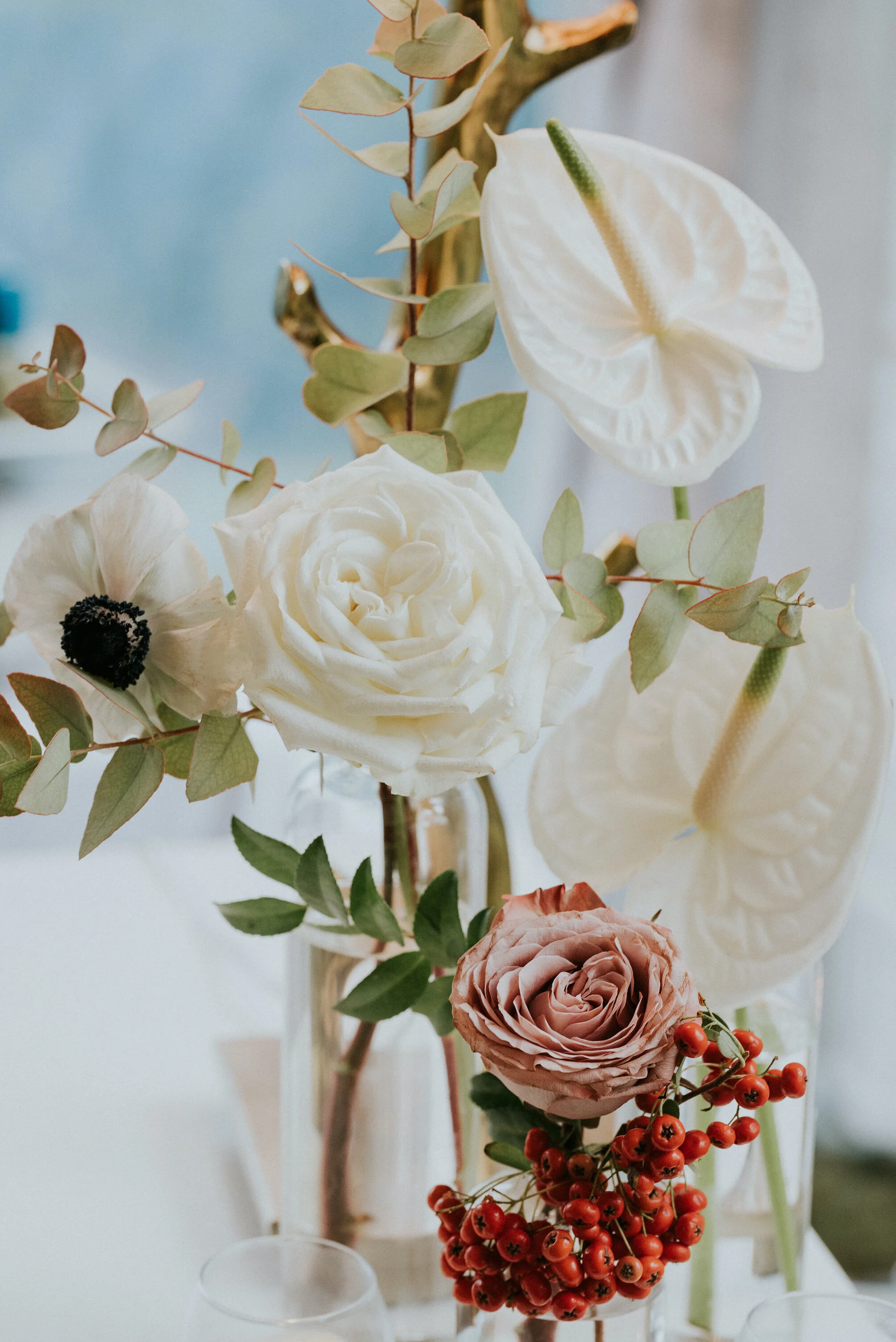 Bohemian and modern yet classically elegant. This wedding perfectly married boho elements of pampas grass, eucalyptus, and dried florals with topical stems of anthurium and orchid. Quicksand roses, cappuccino roses, ilex berry, and rust fern add a p…
