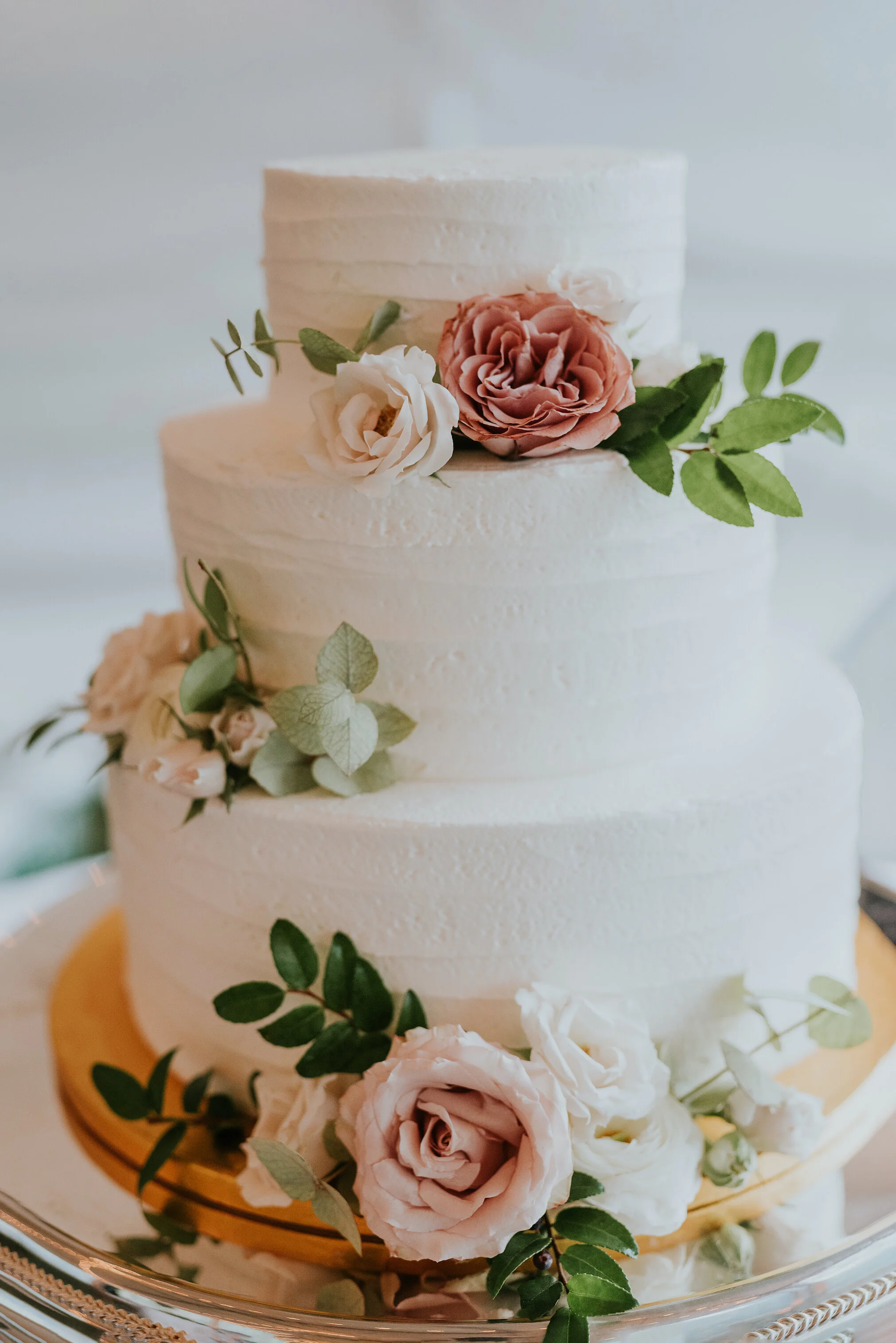 Bohemian and modern yet classically elegant. This wedding perfectly married boho elements of pampas grass, eucalyptus, and dried florals with topical stems of anthurium and orchid. Quicksand roses, cappuccino roses, ilex berry, and rust fern add a p…