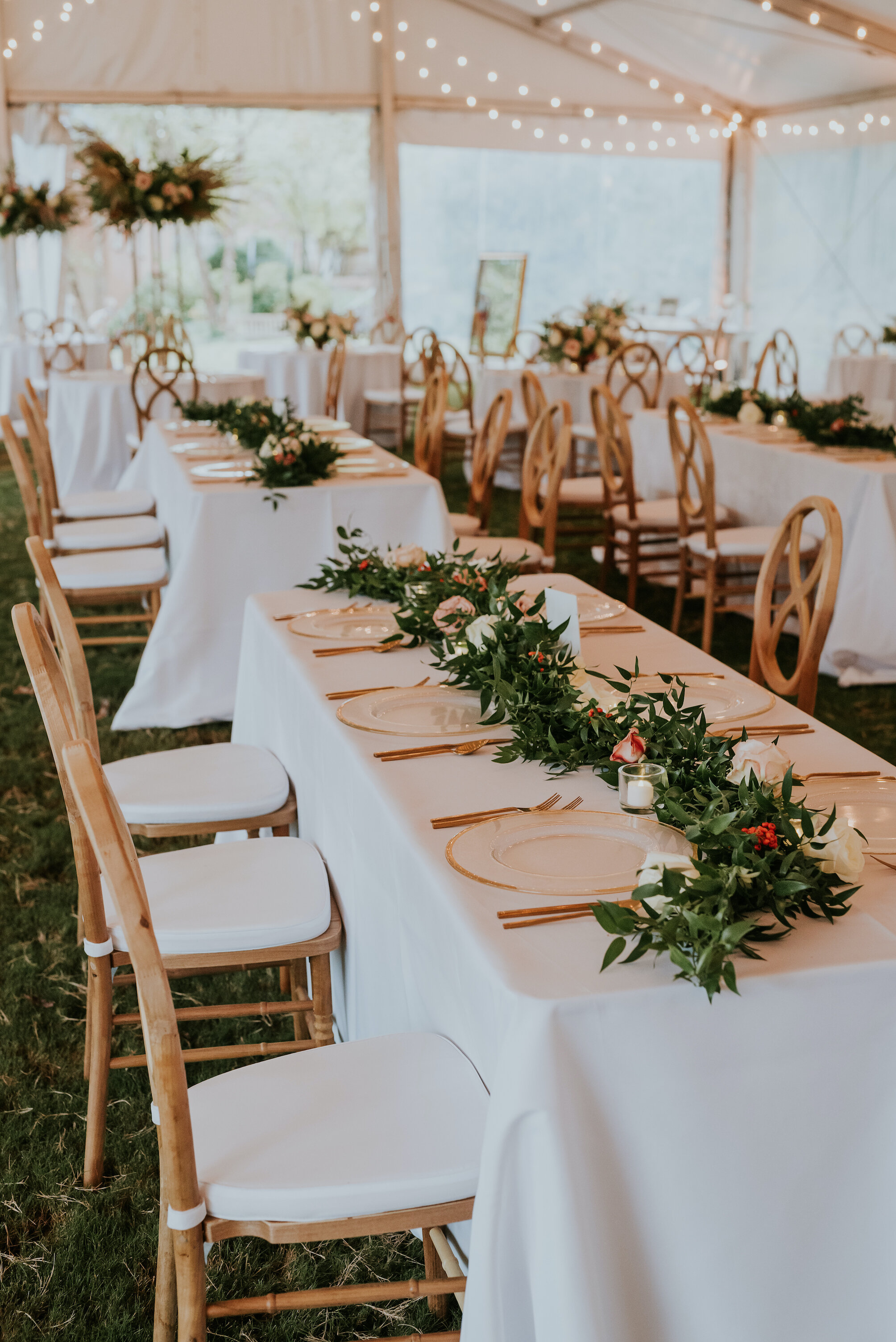 Bohemian and modern yet classically elegant. This wedding perfectly married boho elements of pampas grass, eucalyptus, and dried florals with topical stems of anthurium and orchid. Quicksand roses, cappuccino roses, ilex berry, and rust fern add a p…