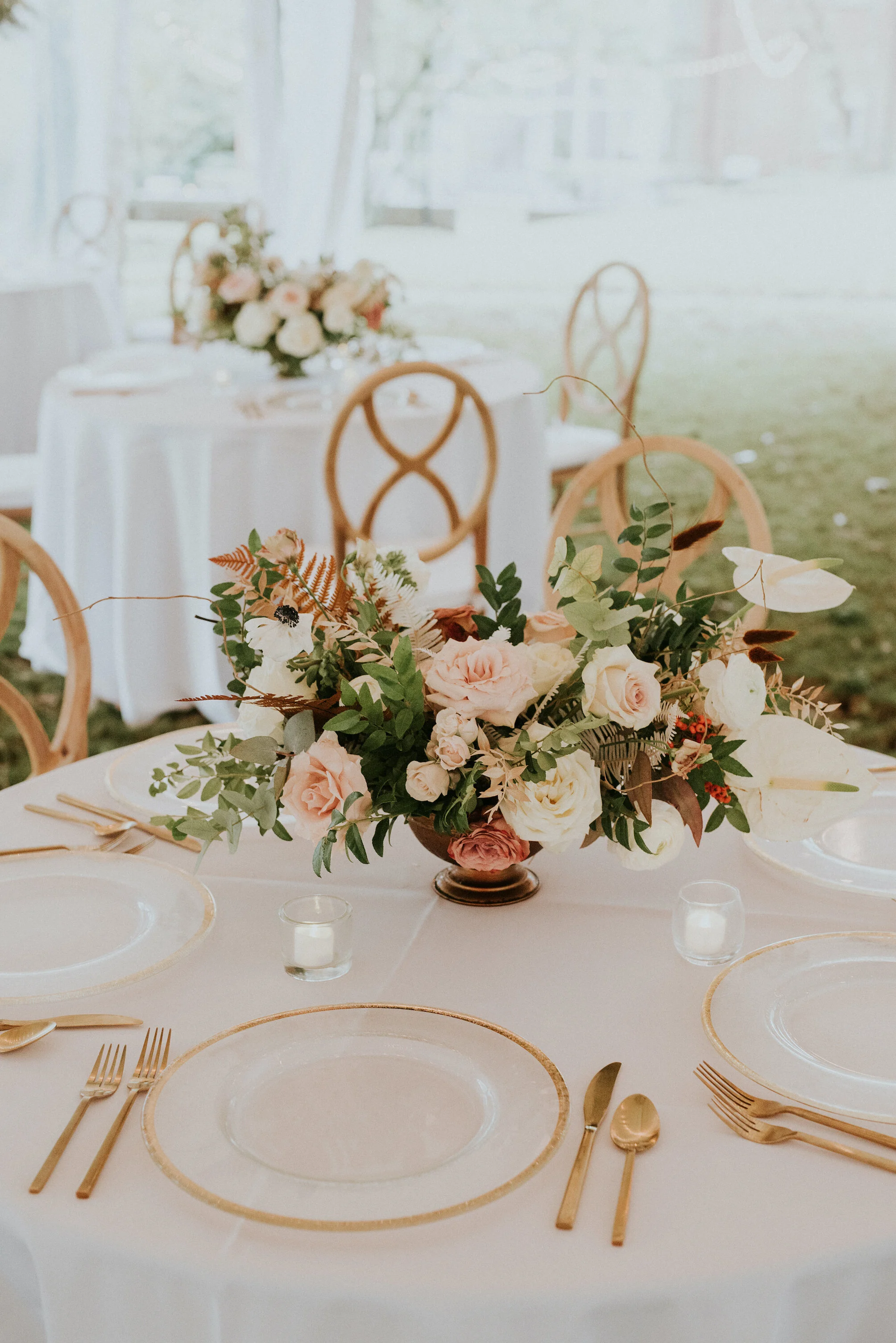 Bohemian and modern yet classically elegant. This wedding perfectly married boho elements of pampas grass, eucalyptus, and dried florals with topical stems of anthurium and orchid. Quicksand roses, cappuccino roses, ilex berry, and rust fern add a p…