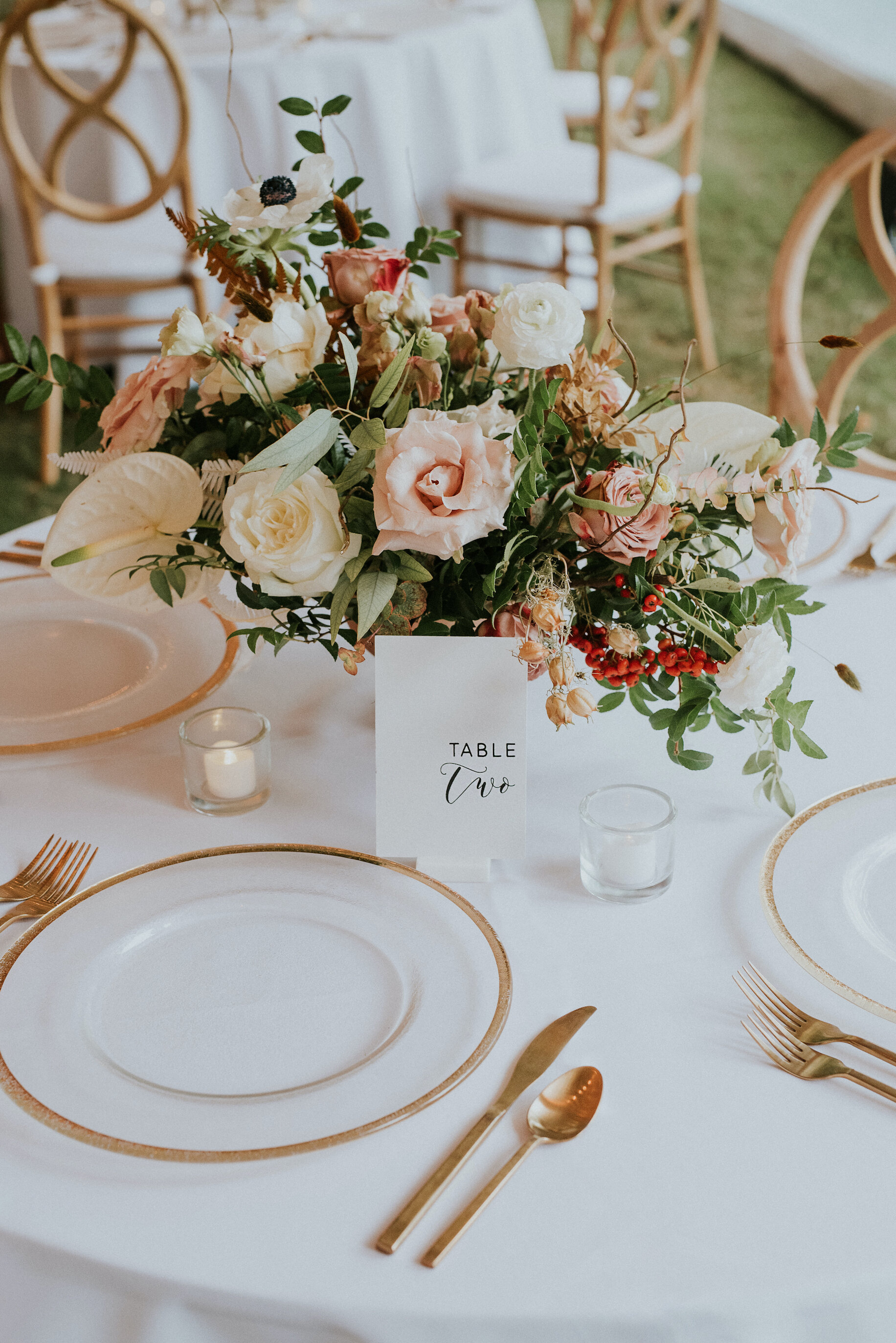 Bohemian and modern yet classically elegant. This wedding perfectly married boho elements of pampas grass, eucalyptus, and dried florals with topical stems of anthurium and orchid. Quicksand roses, cappuccino roses, ilex berry, and rust fern add a p…