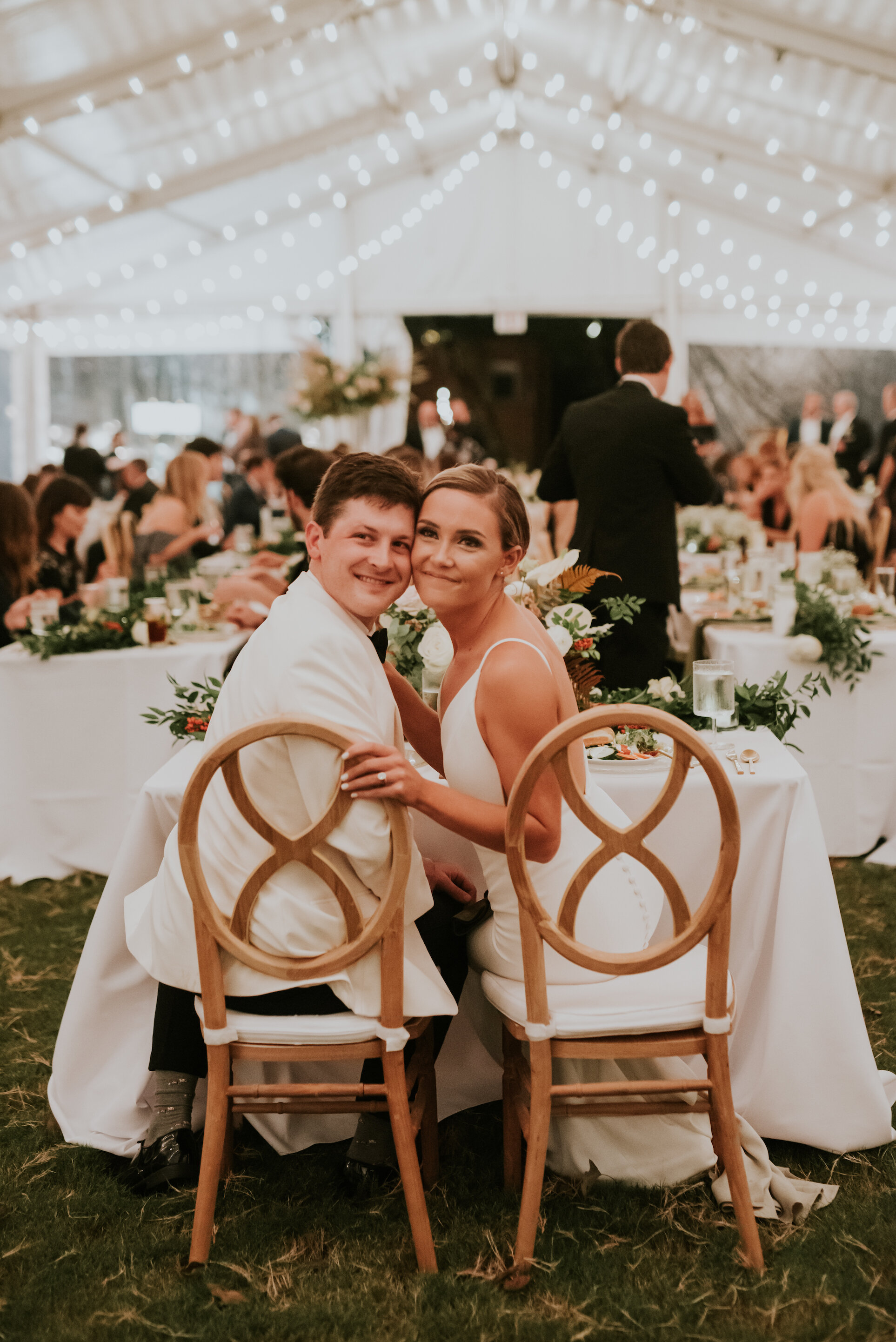 Bohemian and modern yet classically elegant. This wedding perfectly married boho elements of pampas grass, eucalyptus, and dried florals with topical stems of anthurium and orchid. Quicksand roses, cappuccino roses, ilex berry, and rust fern add a p…