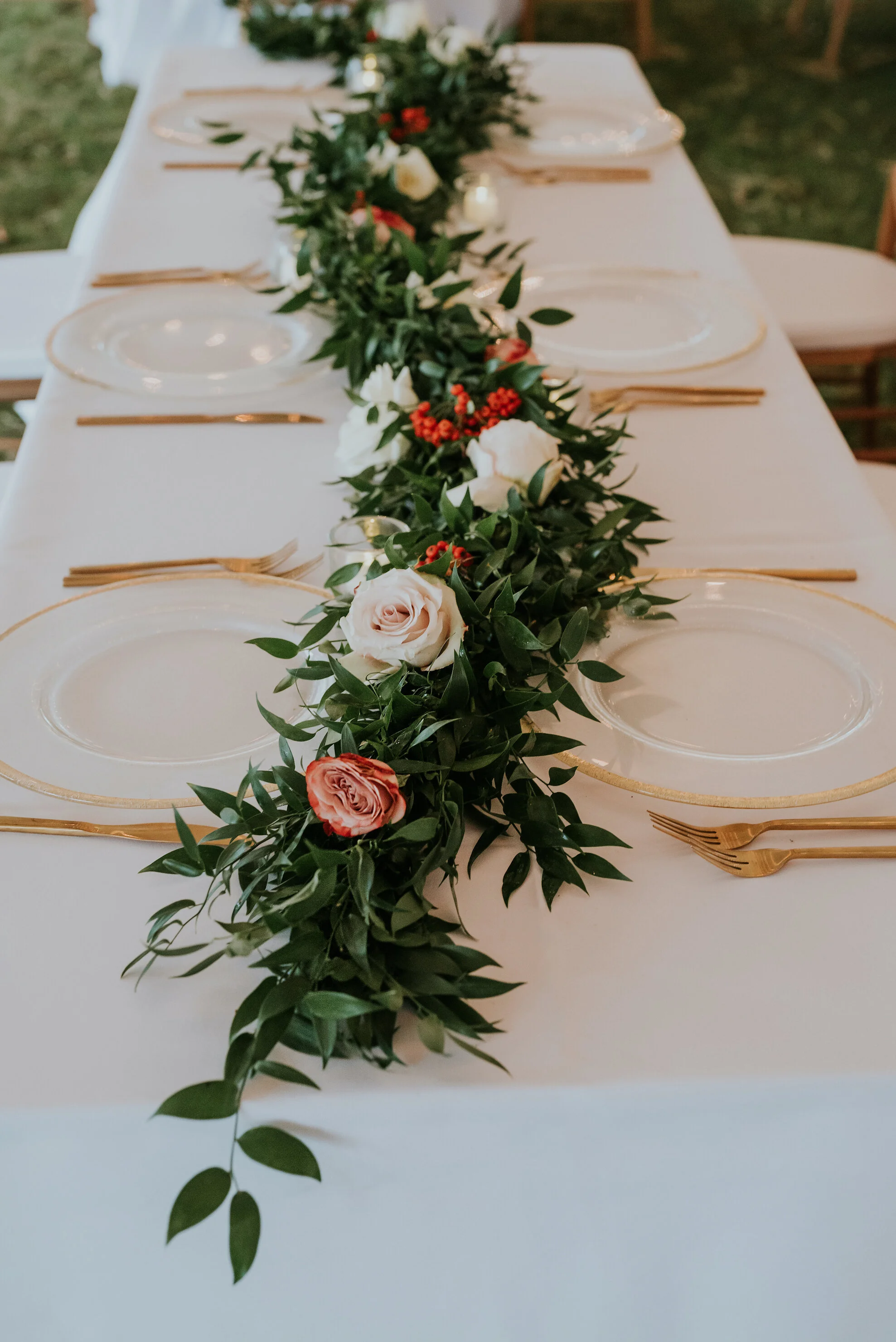 Bohemian and modern yet classically elegant. This wedding perfectly married boho elements of pampas grass, eucalyptus, and dried florals with topical stems of anthurium and orchid. Quicksand roses, cappuccino roses, ilex berry, and rust fern add a p…