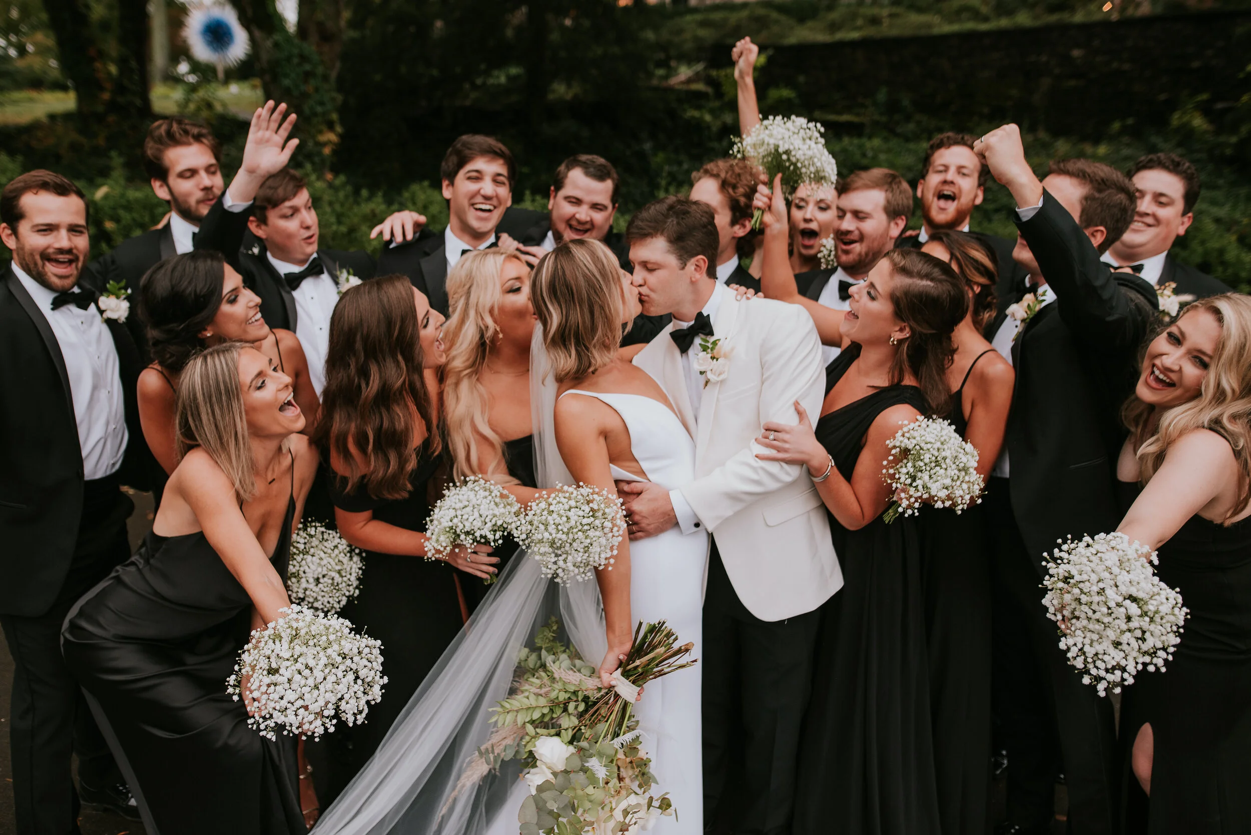 Bohemian and modern yet classically elegant. This Bridal bouquet perfectly married boho elements of pampas grass, eucalyptus, and dried florals with topical stems of anthurium, orchid and ranunculus for a fresh take on white. Paired with simple brid…