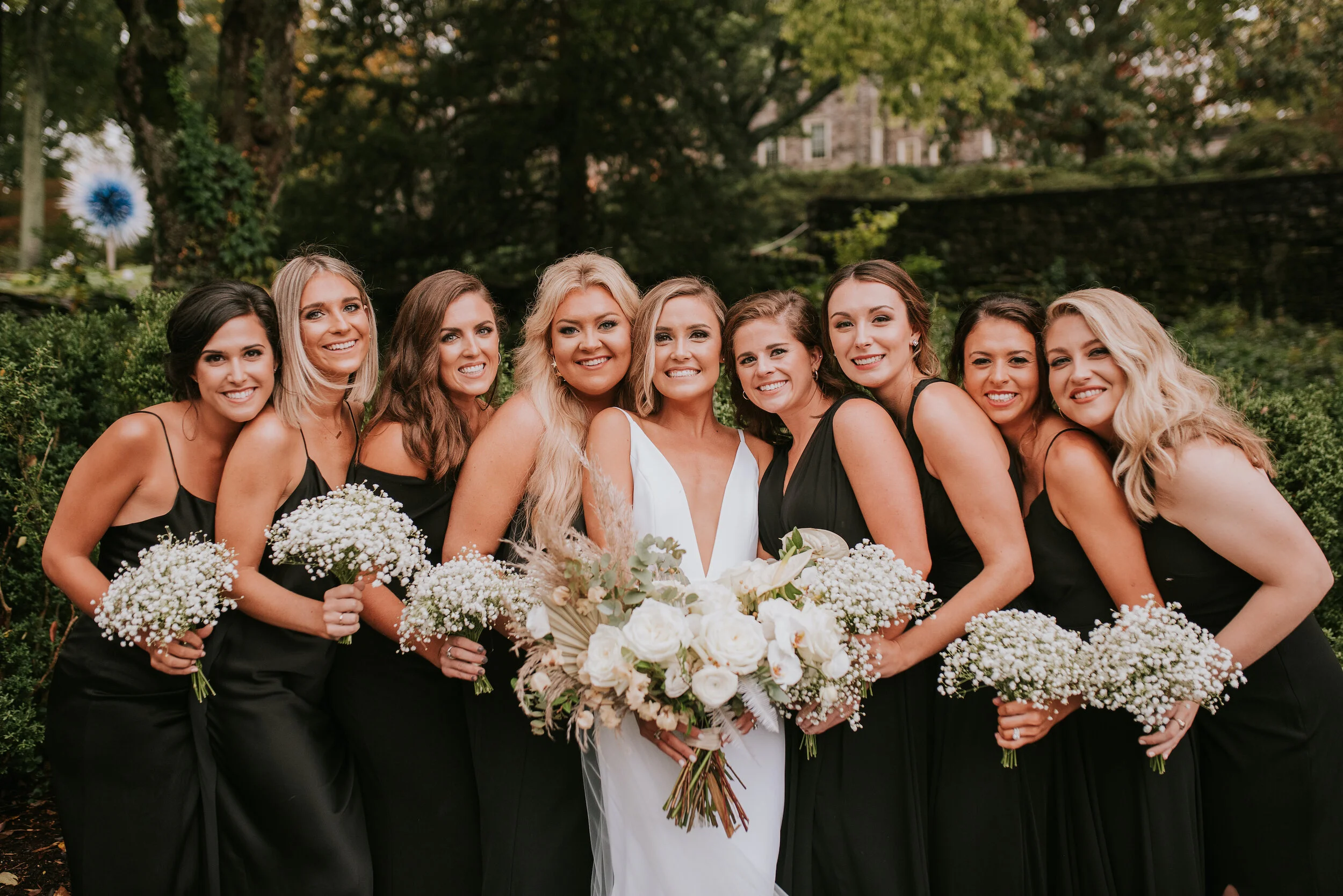 Bohemian and modern yet classically elegant. This Bridal bouquet perfectly married boho elements of pampas grass, eucalyptus, and dried florals with topical stems of anthurium, orchid and ranunculus for a fresh take on white. Paired with simple brid…