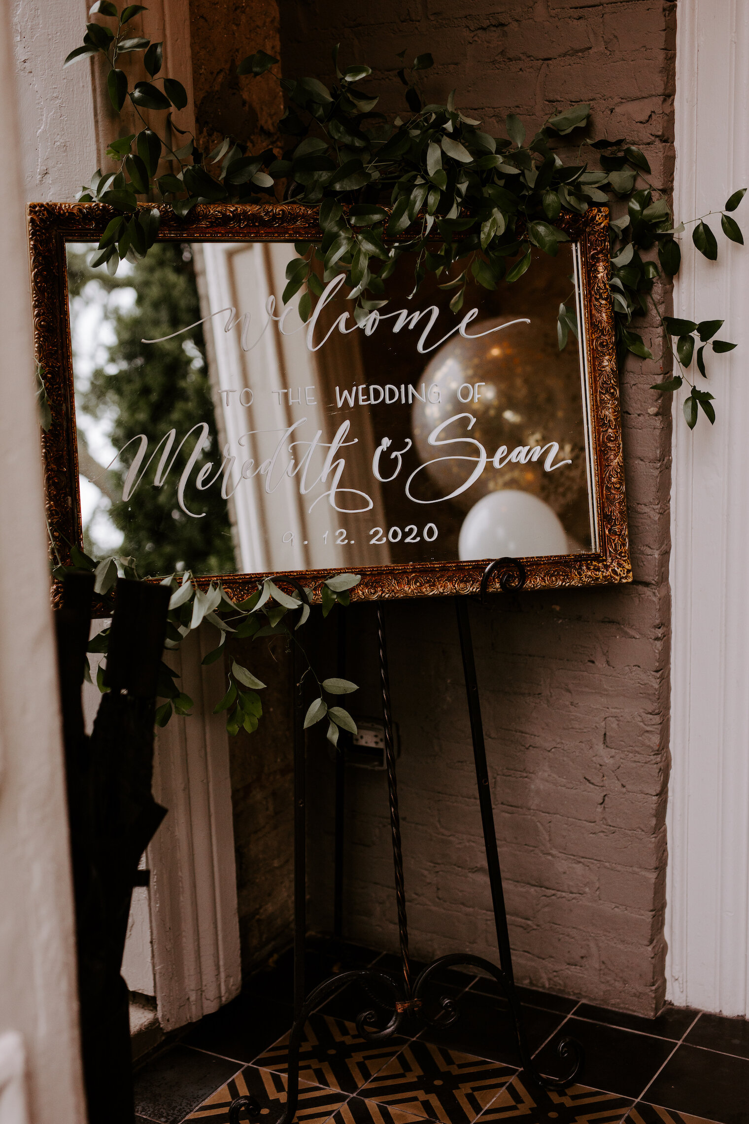 Sprawling smilax over a sweet wedding welcome sign at the Cordelle. Designed by Nashville wedding floral designer, Rosemary & Finch.
