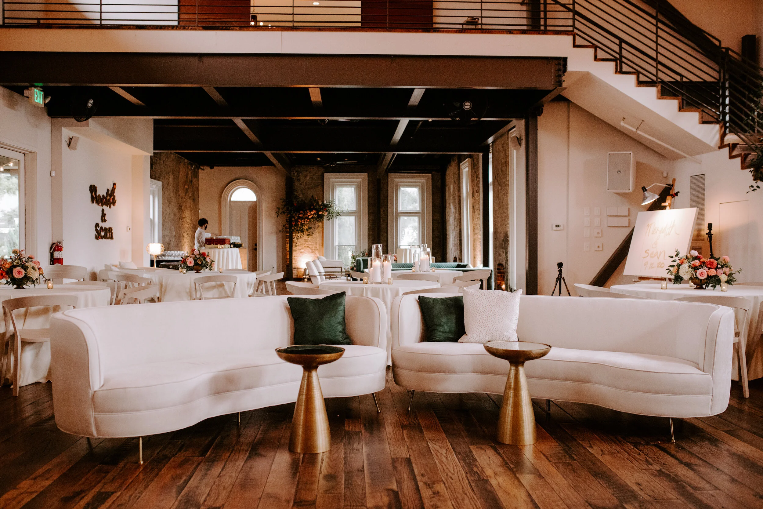 This wedding featured a stunning ceremony arch and a moss and floral wall installation. Blooms used were coral zinnias, fuchsia and blush dahlias, tangerine ranunculus, petal-heavy roses, pink snowberry, and sprawling smilax vine. Designed by Nashvi…