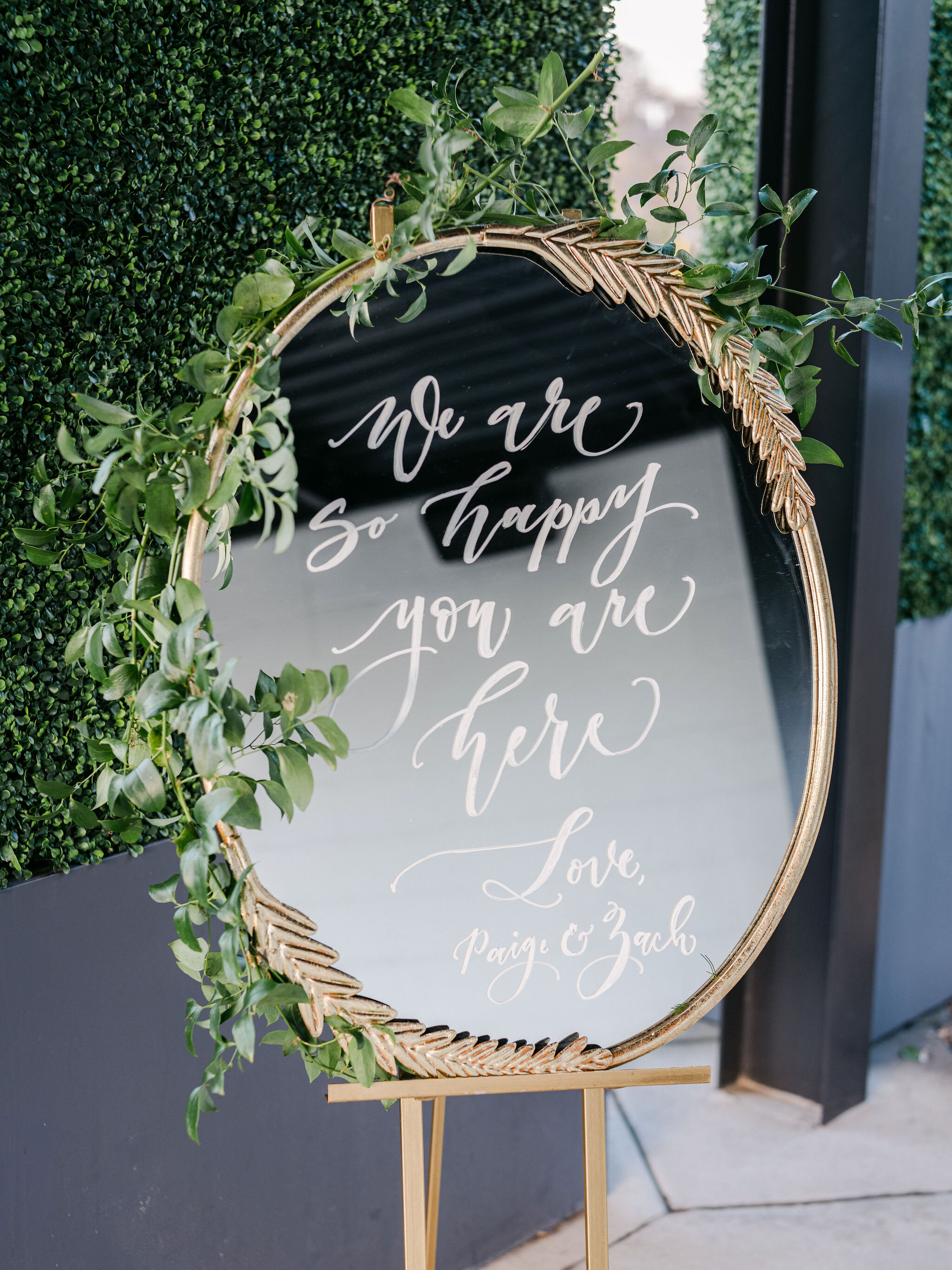 Sprawling smilax over a sweet wedding welcome sign at the Saint Elle. Designed by Nashville wedding floral designer, Rosemary & Finch.
