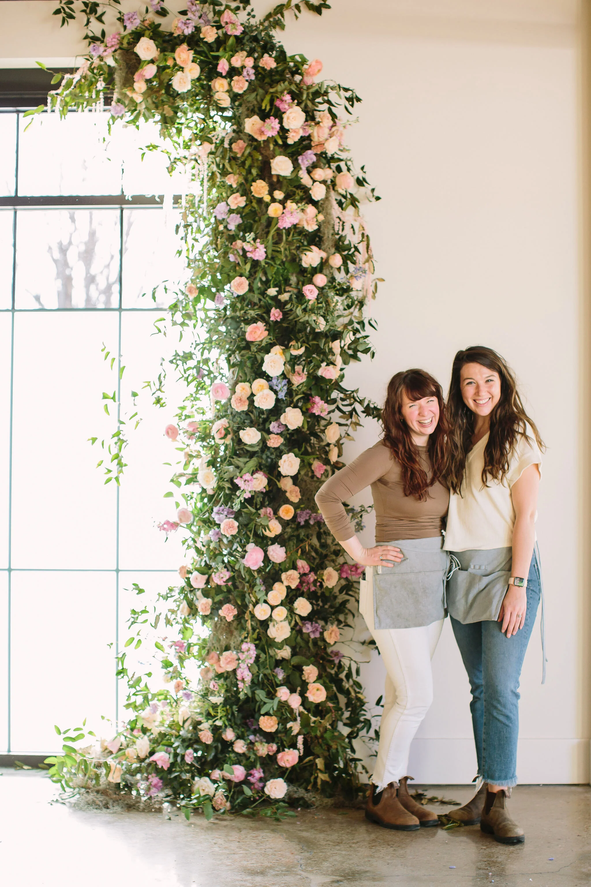 An intimate installation intensive at The Saint Elle in Nashville. Students learned how to create and build 3 different kinds of installations. This climbing window install is filled with flowers in pastel hues including petal heavy roses, lavender …