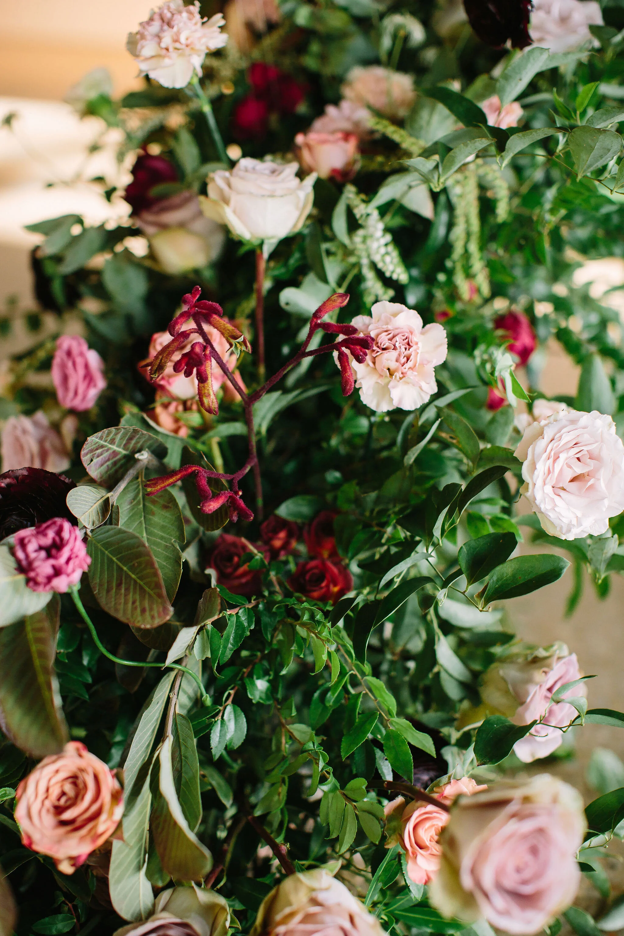 An intimate installation intensive at The Saint Elle in Nashville. Students learned how to create and build 3 different kinds of installations. This spiraling install is filled with rust, plum, and terracotta flowers including toffee and lavender ro…