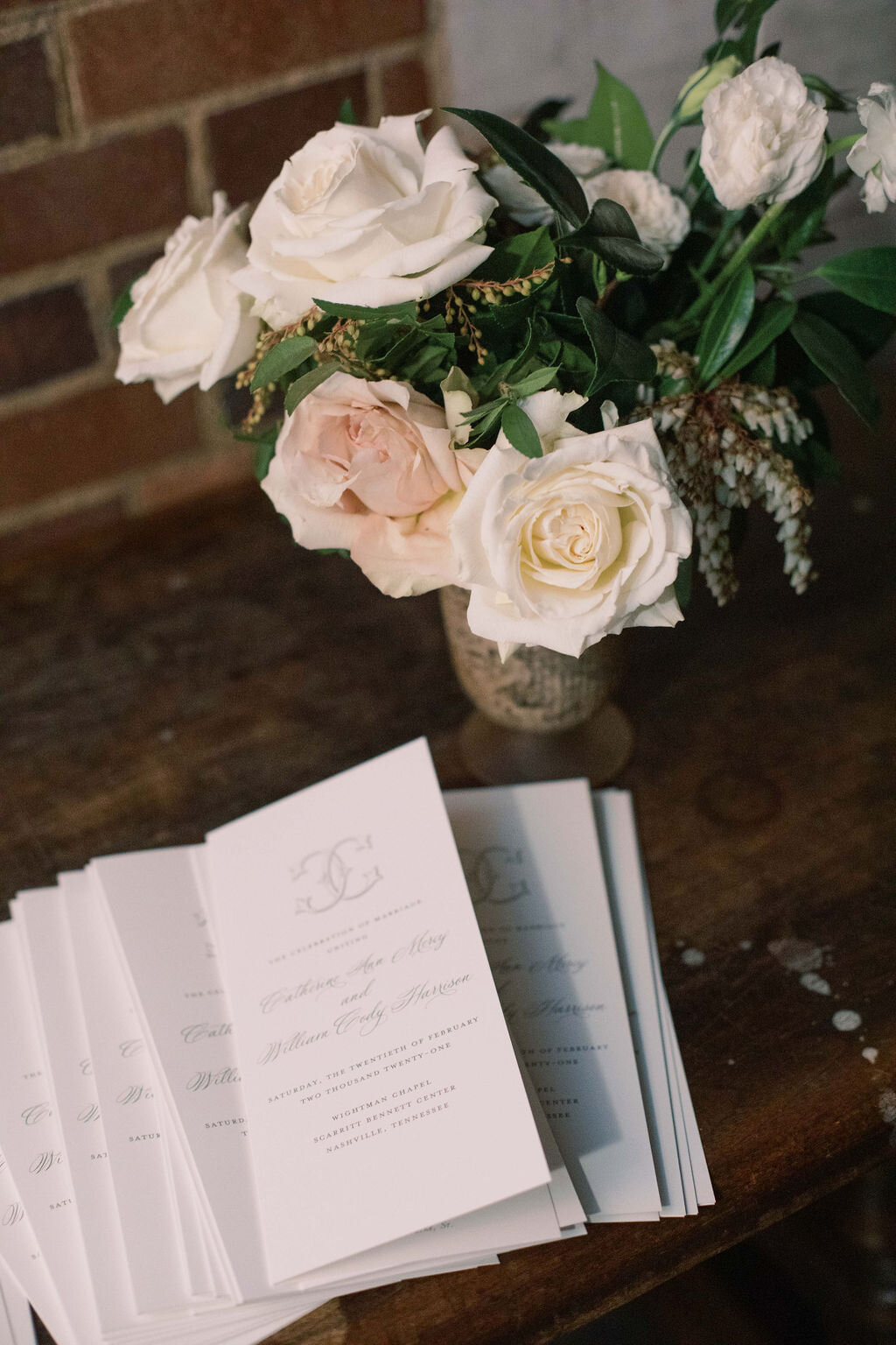 This wintery white wedding at The Cordelle is filled with neutral details, lush blooms, and several unique installations. Designed by florist Rosemary & Finch in Nashville, TN.