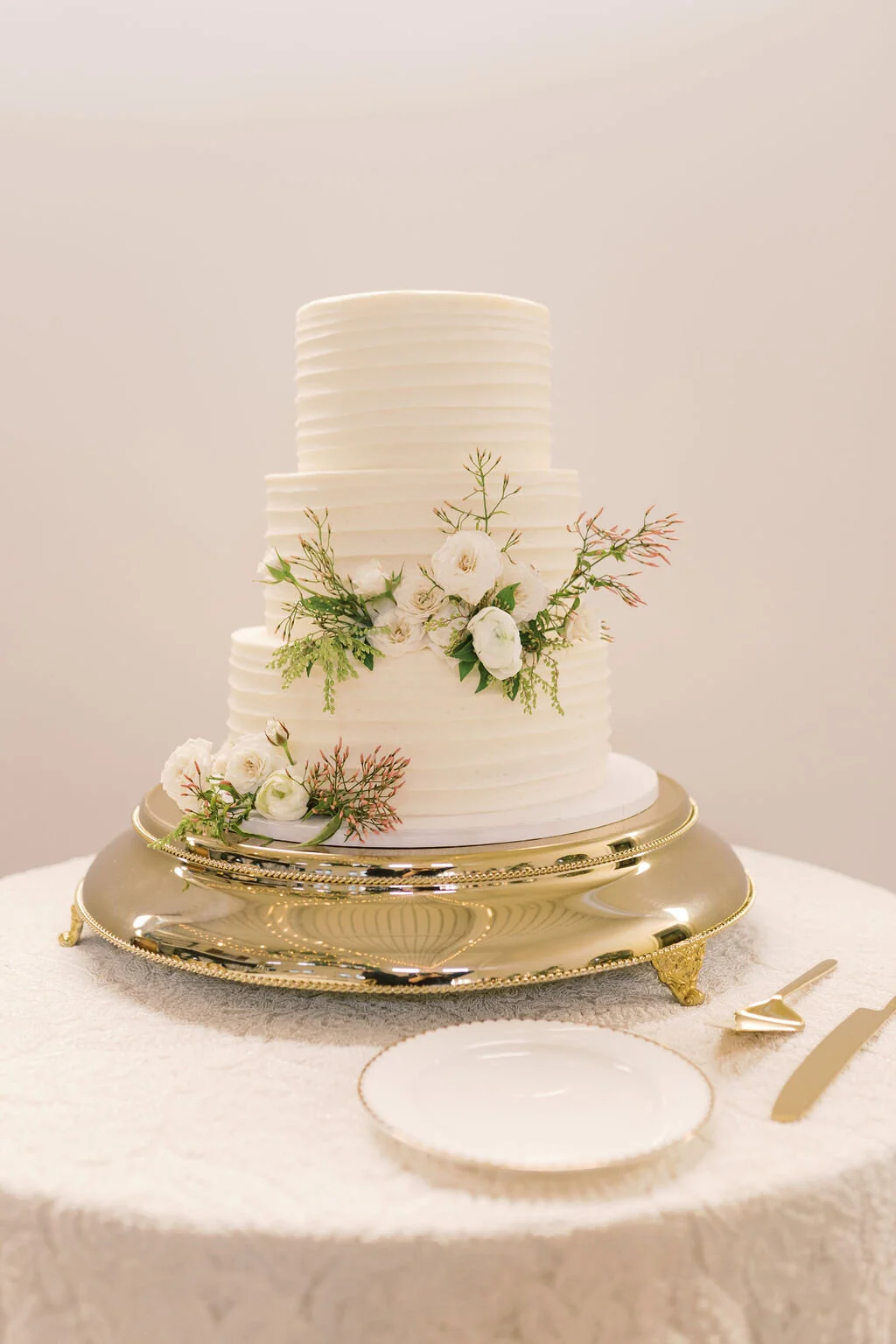 This wintery white wedding at The Cordelle is filled with neutral details, lush blooms, and several unique installations. Designed by florist Rosemary & Finch in Nashville, TN.