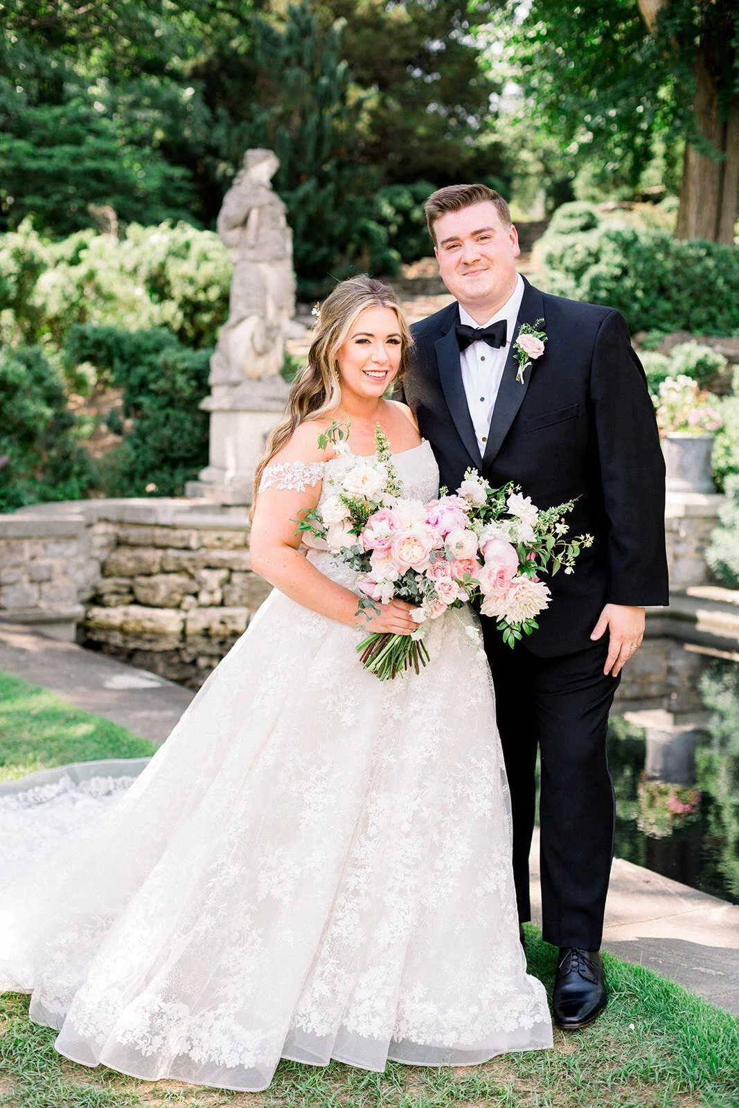 A lush bridal bouquet filled with hues of blush, pink, and ivory. Garden roses, majolica spray roses, champagne roses, peonies, picotee ranunculus, and spirea make up this fairytale bouquet. Designed by Rosemary & Finch in Nashville, TN.