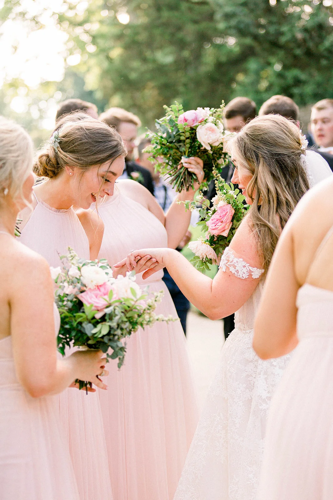 A lush bridal bouquet filled with hues of blush, pink, and ivory. Garden roses, majolica spray roses, champagne roses, peonies, picotee ranunculus, and spirea make up this fairytale bouquet. Designed by Rosemary & Finch in Nashville, TN.