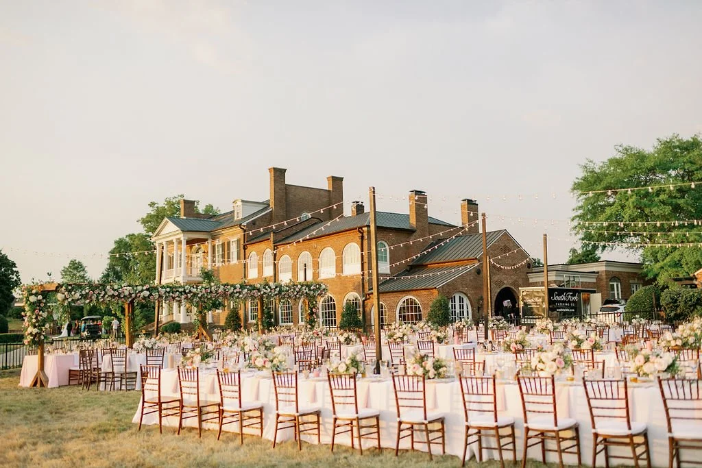 This private estate wedding creates a garden-inspired setting in hues of ivory, pink, blush, and French blue composed of petal heavy roses, peonies, hydrangeas, ranunculus, delphinium, spray roses, and natural greenery. Designed by Rosemary & Finch i