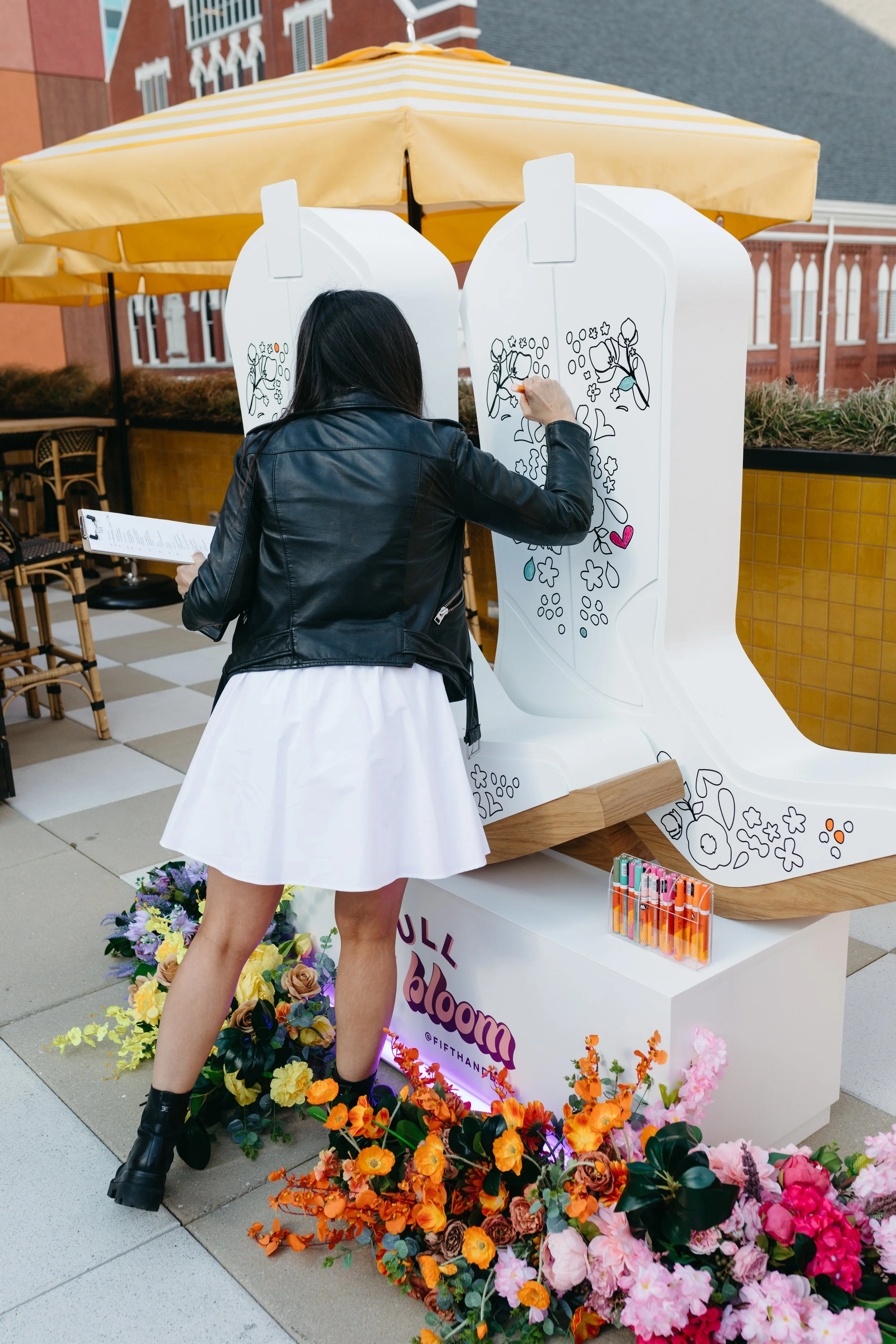 Vibrant floral installations composed of silk floral hues in pink, magenta, lavender, coral, orange, yellow, and mixed greens bring to life this spring Fifth + Broadway event in Nashville, TN. Design by Rosemary and Finch.