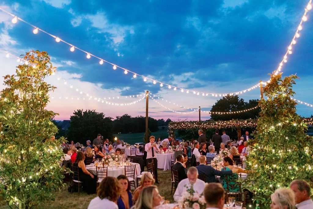 This private estate wedding creates a garden-inspired setting in hues of ivory, pink, blush, and French blue composed of petal heavy roses, peonies, hydrangeas, ranunculus, delphinium, spray roses, and natural greenery. Designed by Rosemary & Finch i