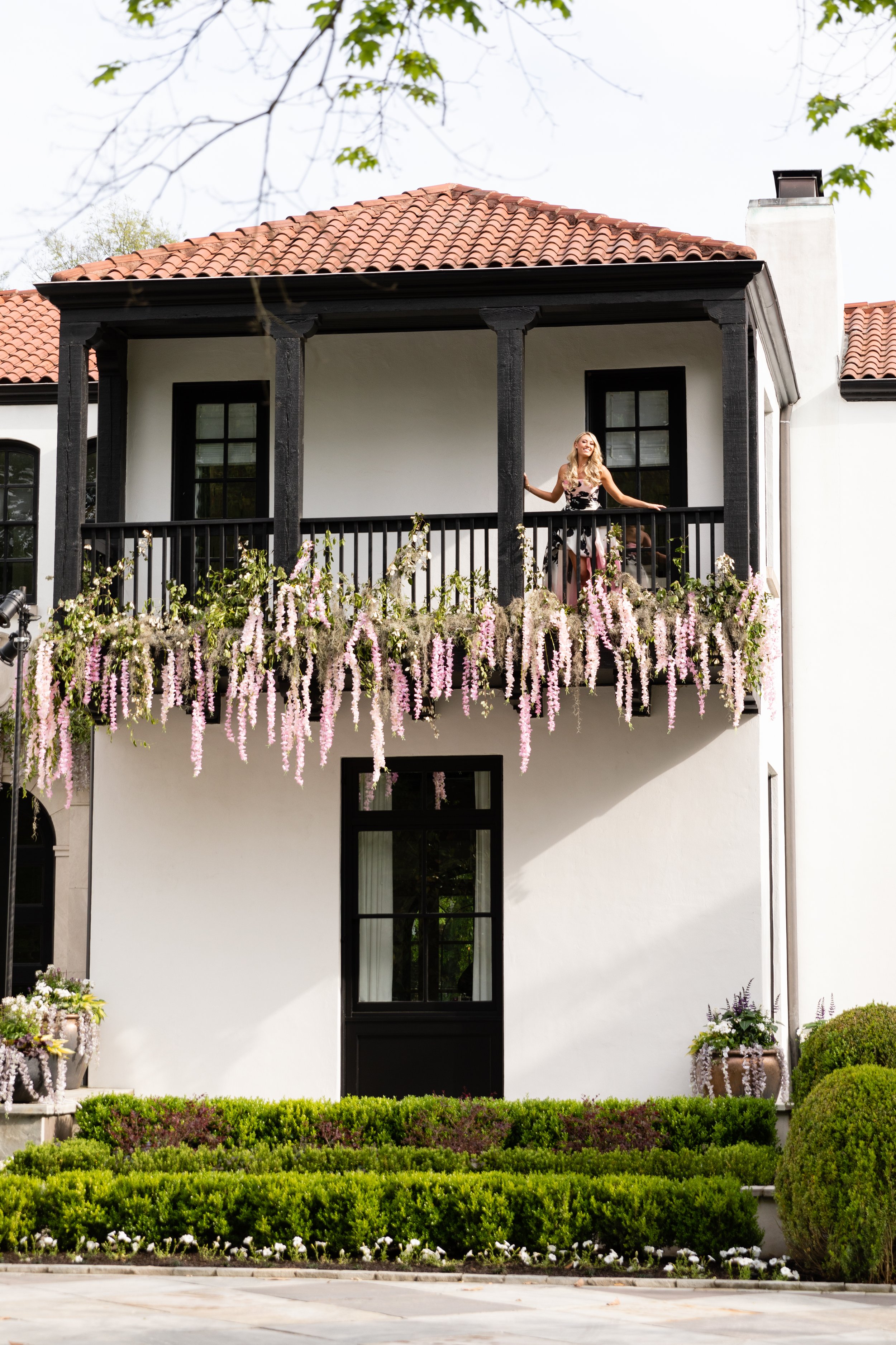 Bridgerton inspired engagement party at a private home in Nashville, TN with lush, organic floral installations of wisteria, spanish moss, and pastel blooms.