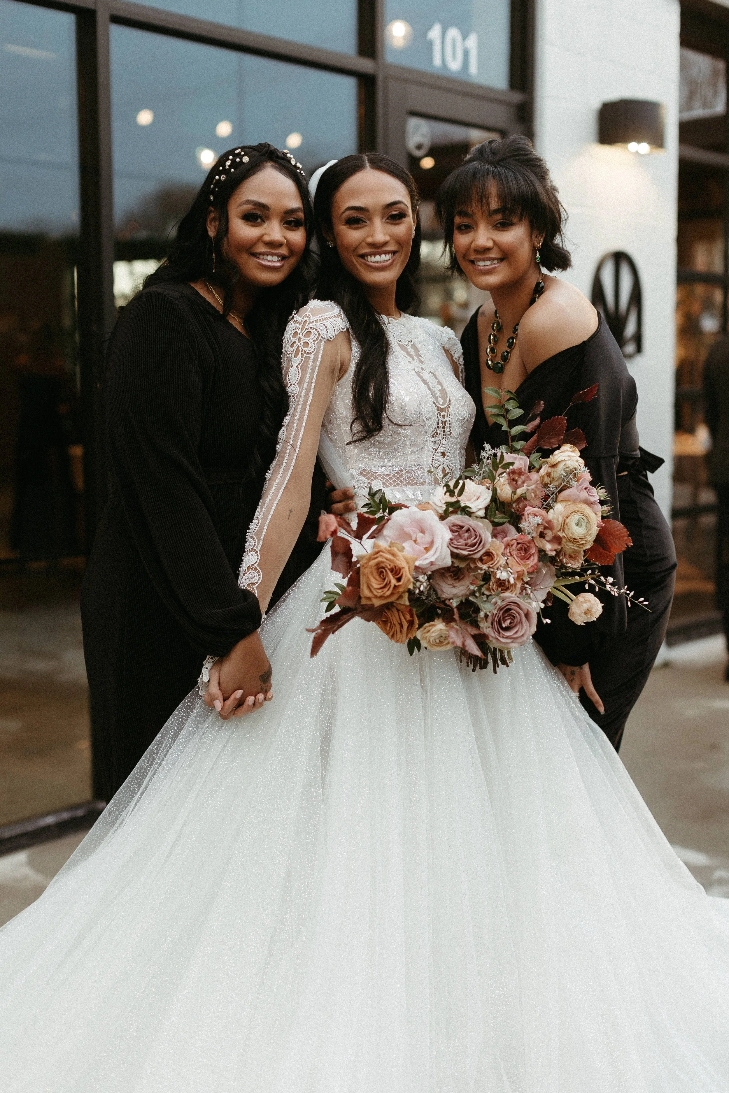 This elegant bridal bouquet brought hues of mauve, dusty pink, cream, burgundy, and terra cotta to this winter wedding. Lush with petal heavy roses, ranunculus, spray roses, copper beech, and greenery. Designed by Rosemary and Finch in Nashville, TN.