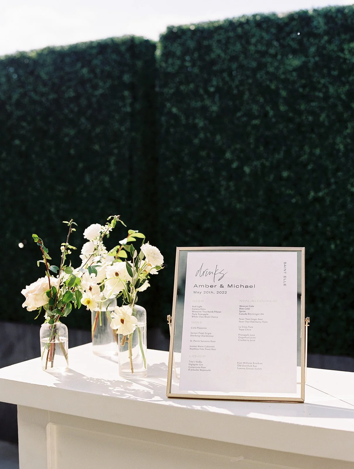 Classic white, cream, and blush wedding flowers. Florals composed of roses, ranunculus, Queen Anne’s lace, and greenery. Designed by Rosemary and Finch in Nashville, TN.