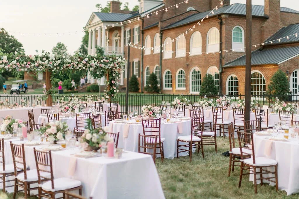 This private estate wedding creates a garden-inspired setting in hues of ivory, pink, blush, and French blue composed of petal heavy roses, peonies, hydrangeas, ranunculus, delphinium, spray roses, and natural greenery. Designed by Rosemary & Finch i