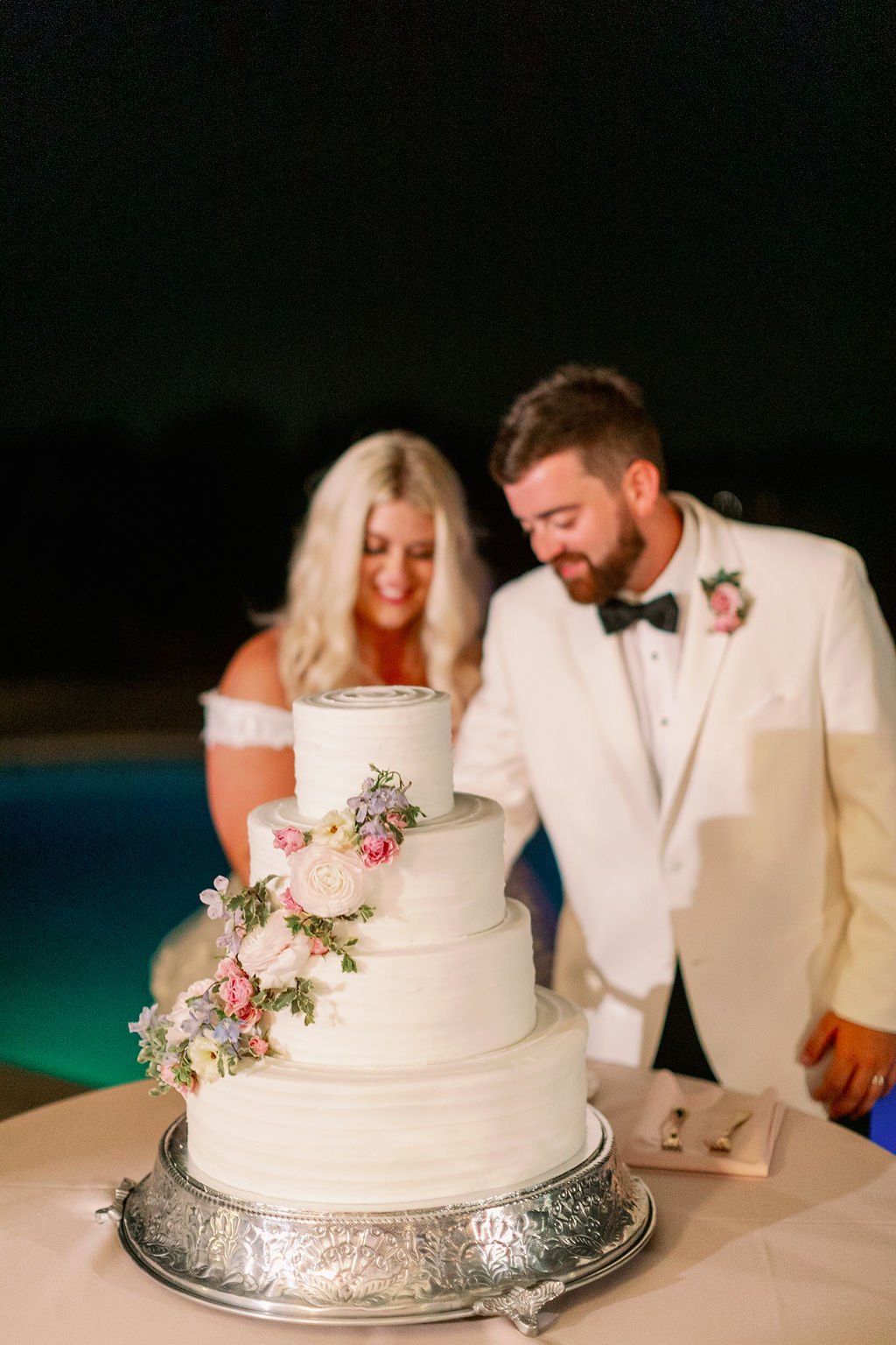 This private estate wedding creates a garden-inspired setting in hues of ivory, pink, blush, and French blue composed of petal heavy roses, peonies, hydrangeas, ranunculus, delphinium, spray roses, and natural greenery. Designed by Rosemary & Finch i