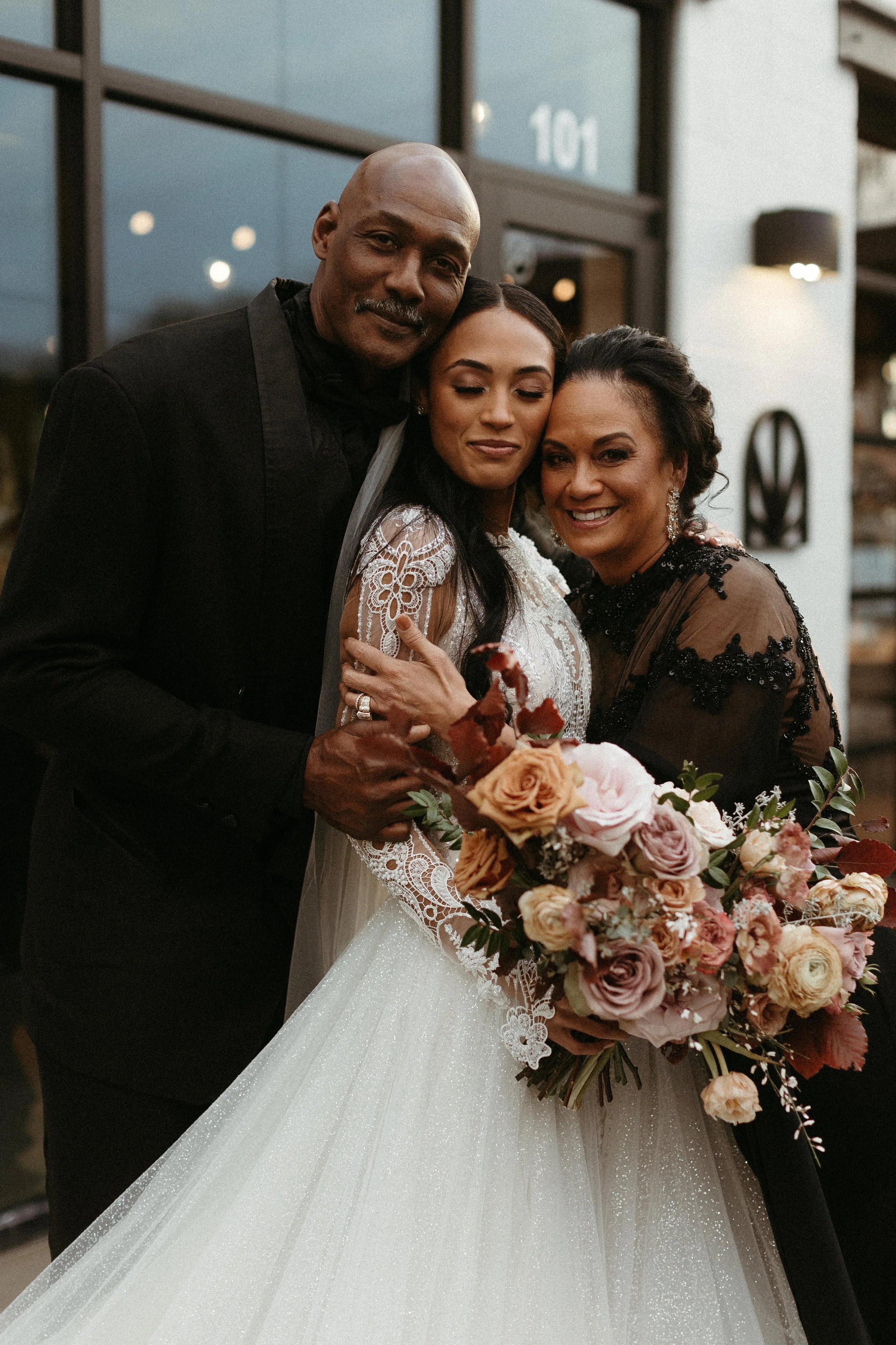 This elegant bridal bouquet brought hues of mauve, dusty pink, cream, burgundy, and terra cotta to this winter wedding. Lush with petal heavy roses, ranunculus, spray roses, copper beech, and greenery. Designed by Rosemary and Finch in Nashville, TN.