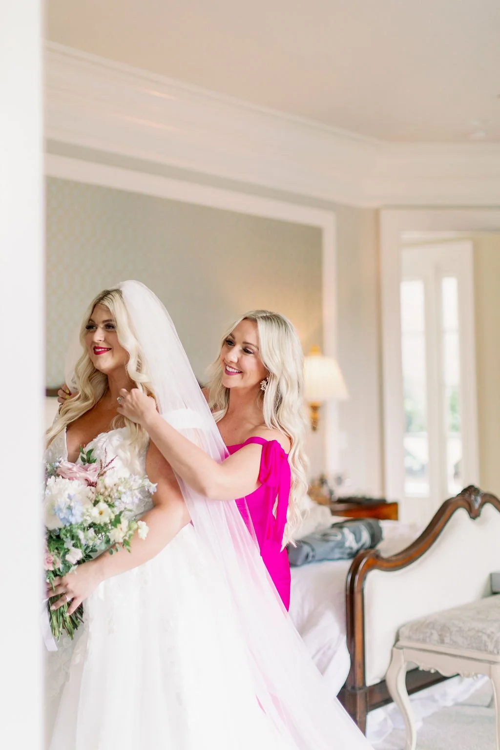 A lush bridal bouquet filled with hues of blush, pink, ivory, and hints of French blue. Garden roses, majolica spray roses, champagne roses, peonies, ranunculus, delphinium, and spirea make up this fairytale bouquet. Designed by Rosemary & Finch in N