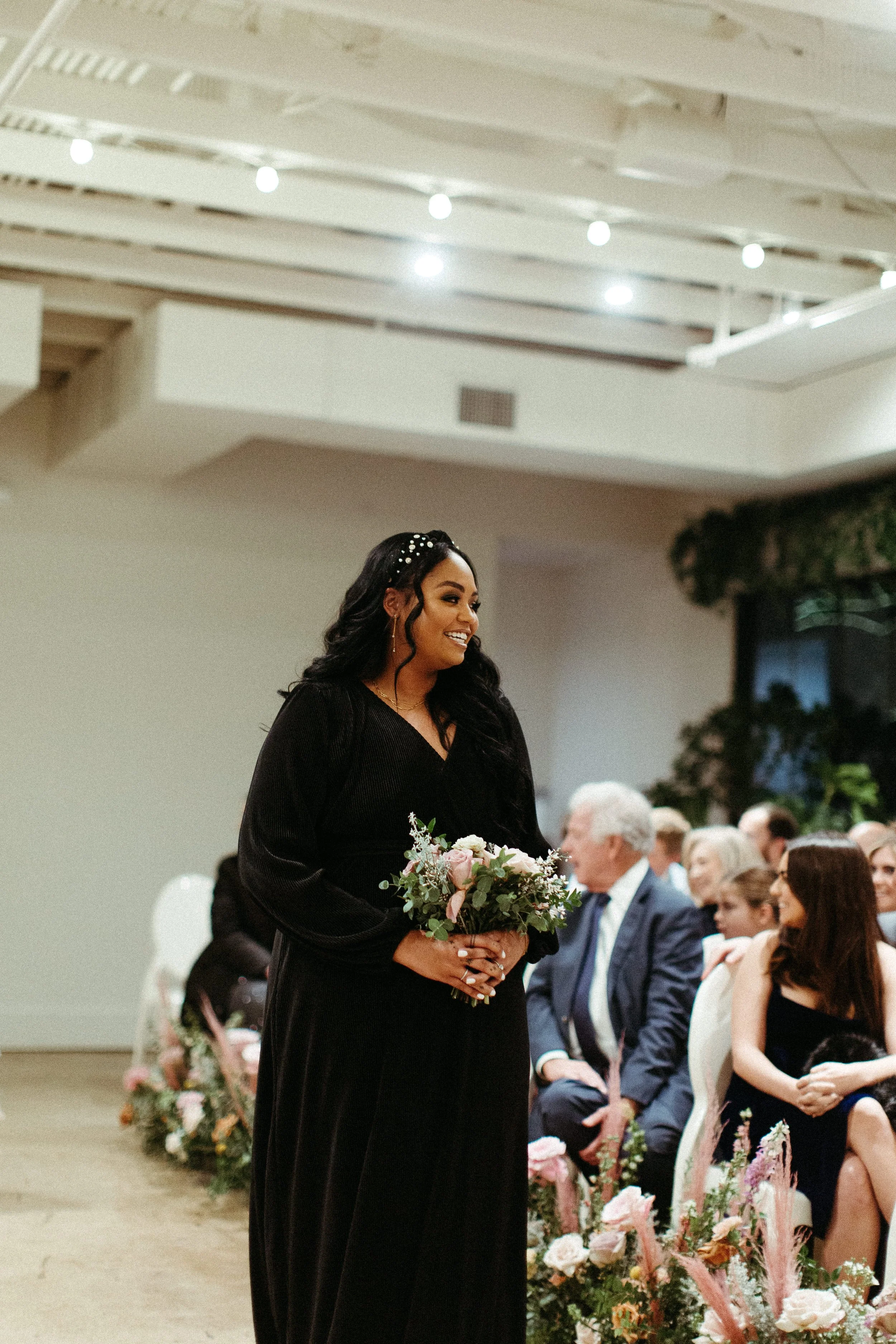 Beautiful bridal party bouquets brought warm hues of dusty pink, terra cotta, mauve, and burgundy. Art deco wedding florals comprised of roses, ranunculus, dried branches, and greenery. Designed by Rosemary and Finch in Nashville, TN.