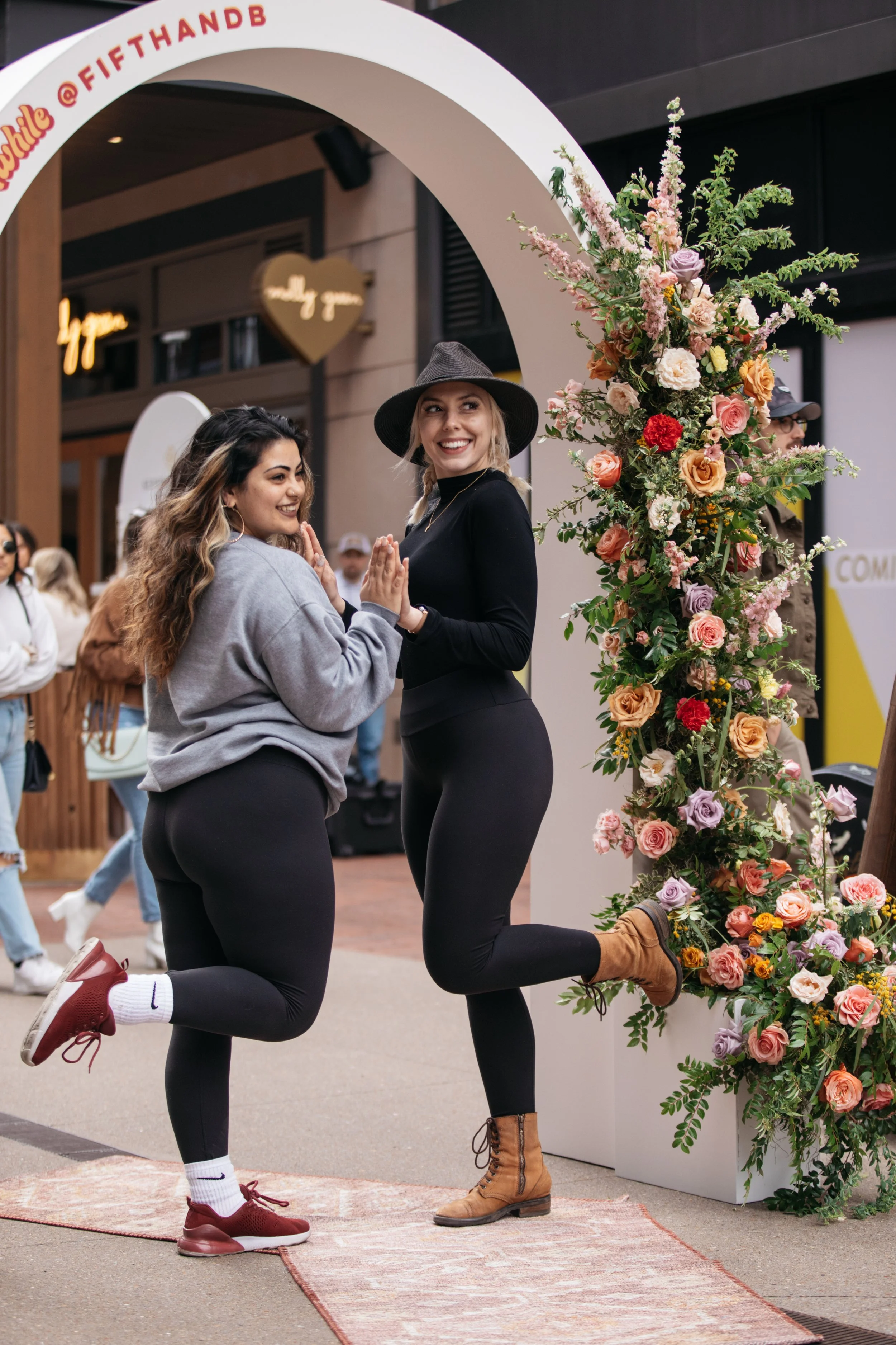 Bright spring floral hues of pink, lavender, coral, magenta, and yellow inspire the event space of Fifth + Broadway in Nashville, TN. Florals composed of roses, ranunculus, sweet peas, butterfly ranunculus, mixed greenery. Design by Rosemary and Finc