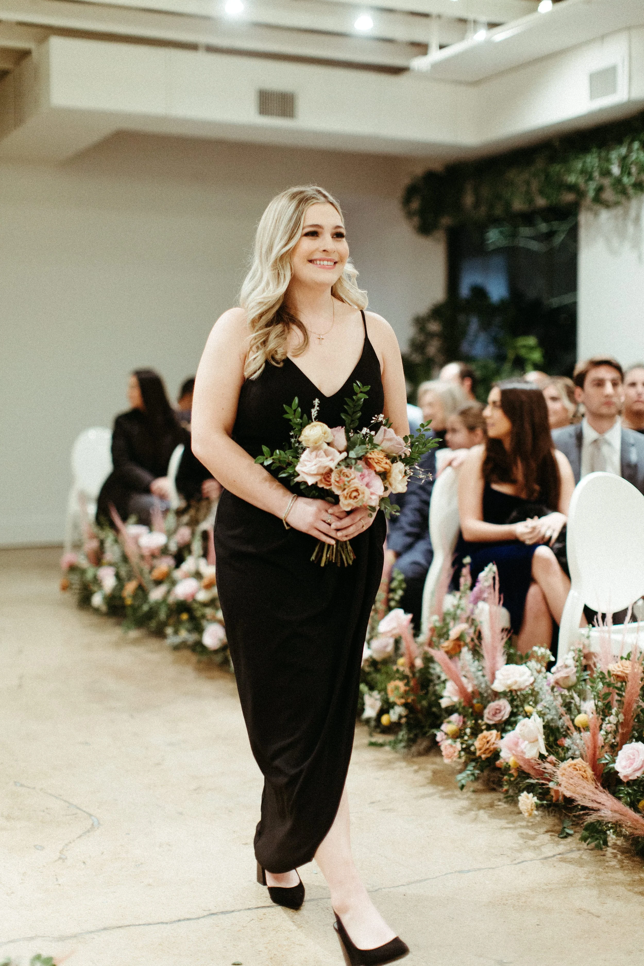 Beautiful bridal party bouquets brought warm hues of dusty pink, terra cotta, mauve, and burgundy. Art deco wedding florals comprised of roses, ranunculus, dried branches, and greenery. Designed by Rosemary and Finch in Nashville, TN.