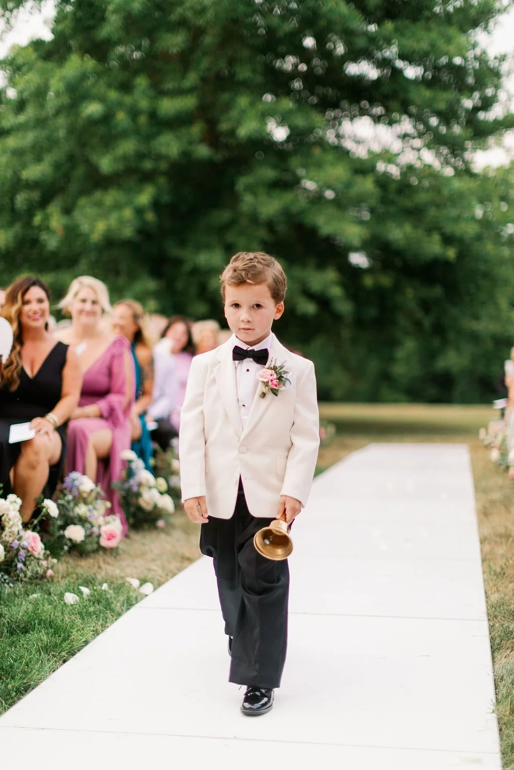 This private estate wedding creates a garden-inspired setting in hues of ivory, pink, blush, and French blue composed of petal heavy roses, peonies, hydrangeas, ranunculus, delphinium, spray roses, and natural greenery. Designed by Rosemary & Finch i