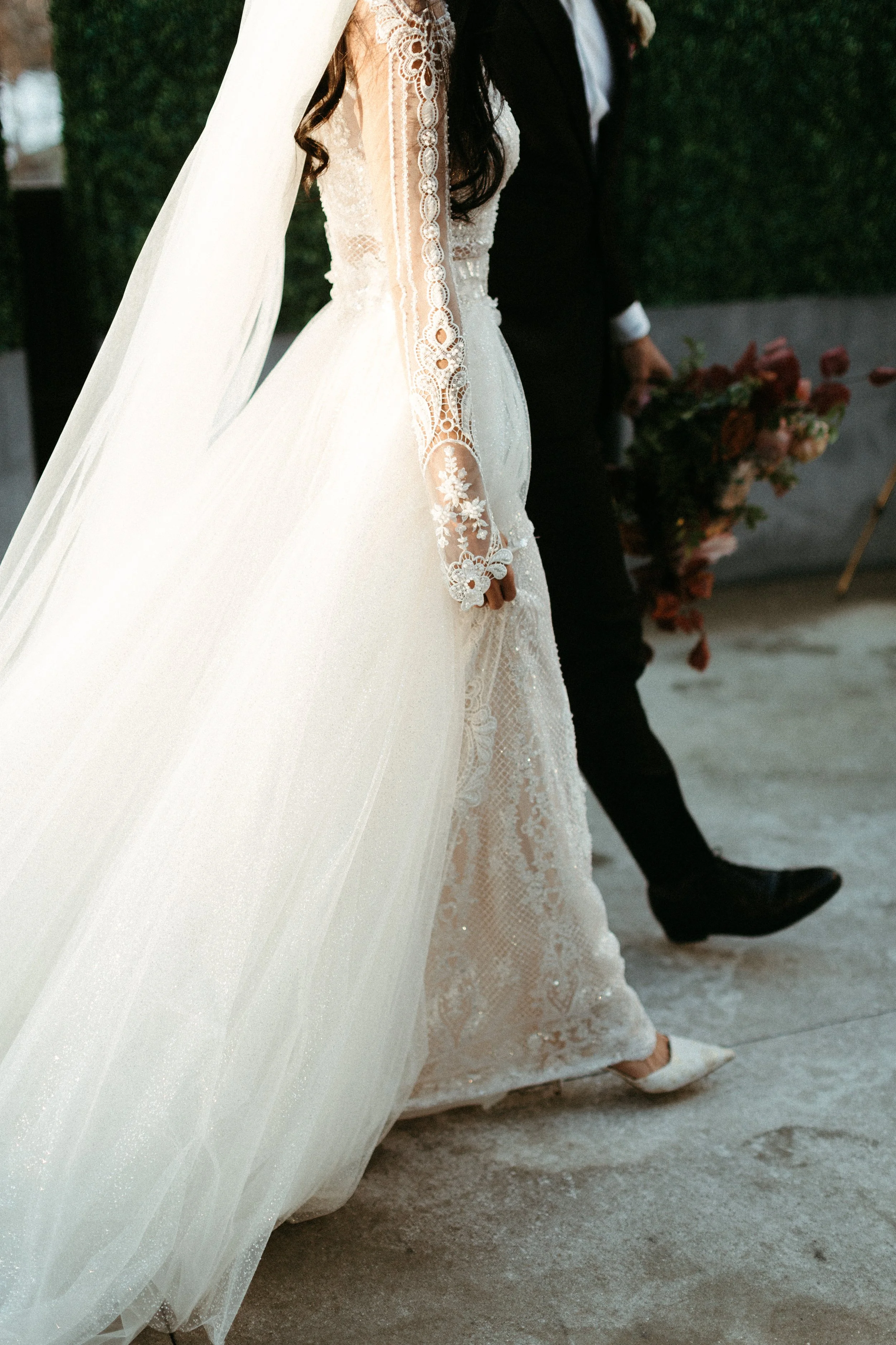 This elegant bridal bouquet brought hues of mauve, dusty pink, cream, burgundy, and terra cotta to this winter wedding. Lush with petal heavy roses, ranunculus, spray roses, copper beech, and greenery. Designed by Rosemary and Finch in Nashville, TN.