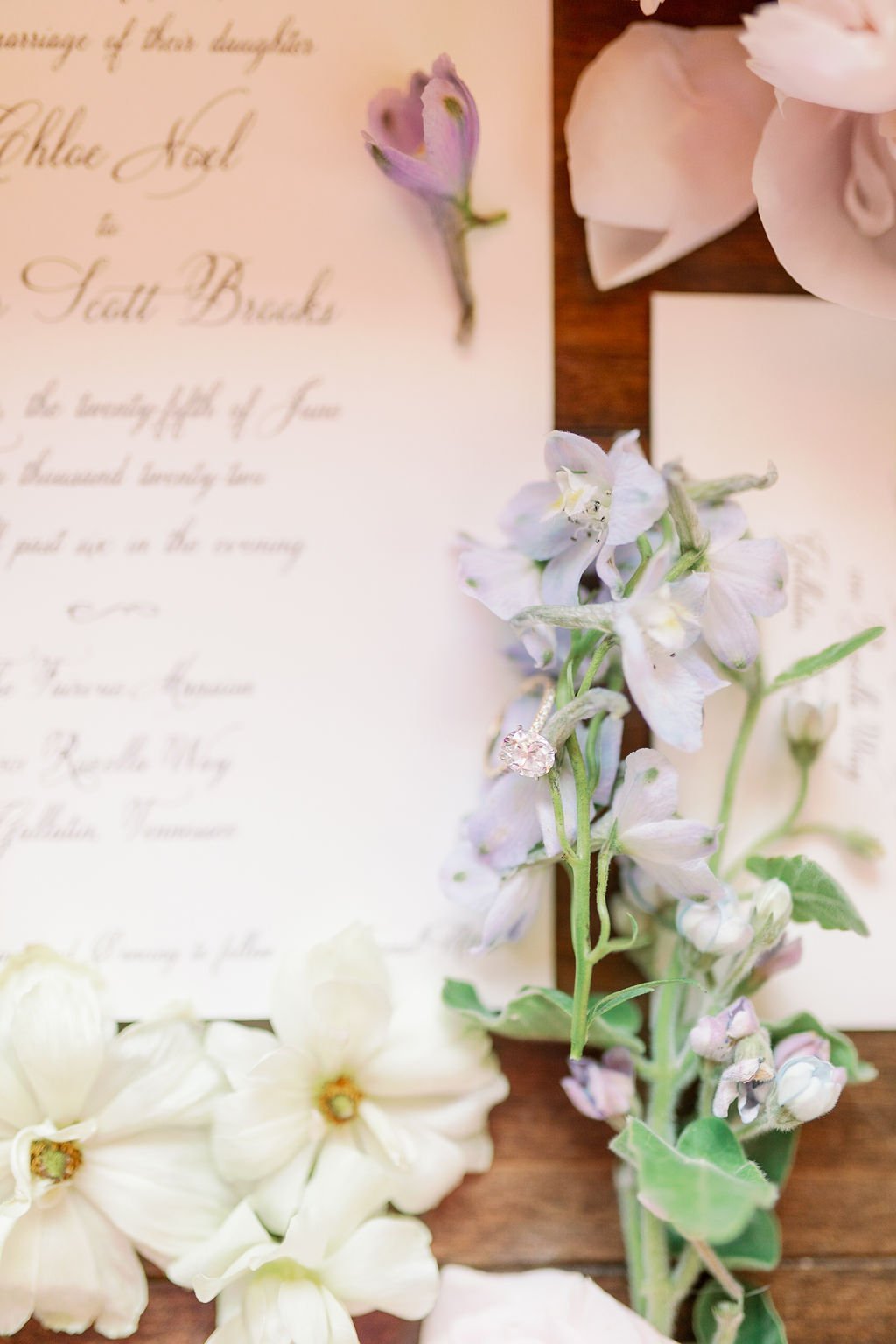 This private estate wedding creates a garden-inspired setting in hues of ivory, pink, blush, and French blue composed of petal heavy roses, peonies, hydrangeas, ranunculus, delphinium, spray roses, and natural greenery. Designed by Rosemary & Finch i