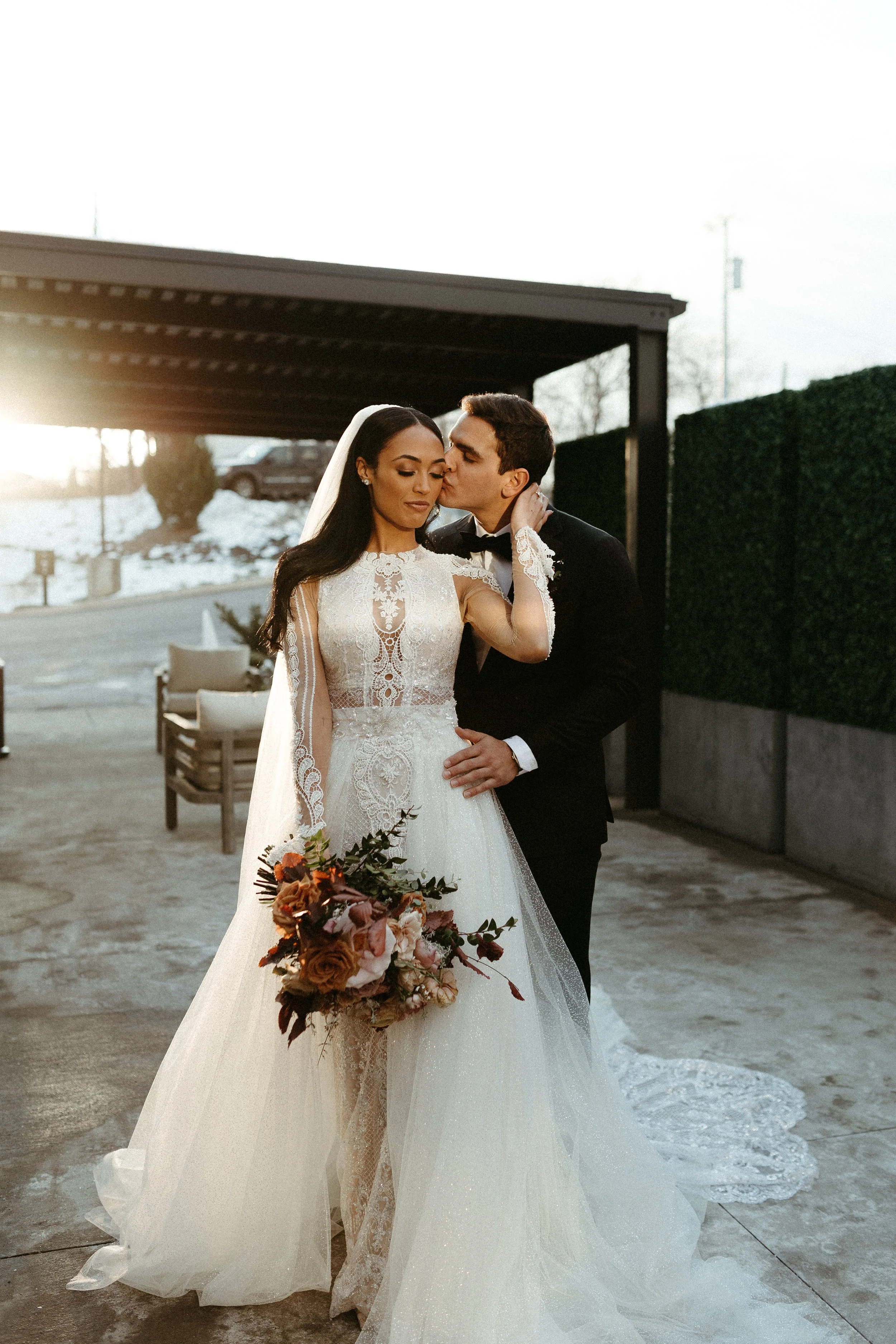 This elegant bridal bouquet brought hues of mauve, dusty pink, cream, burgundy, and terra cotta to this winter wedding. Lush with petal heavy roses, ranunculus, spray roses, copper beech, and greenery. Designed by Rosemary and Finch in Nashville, TN.