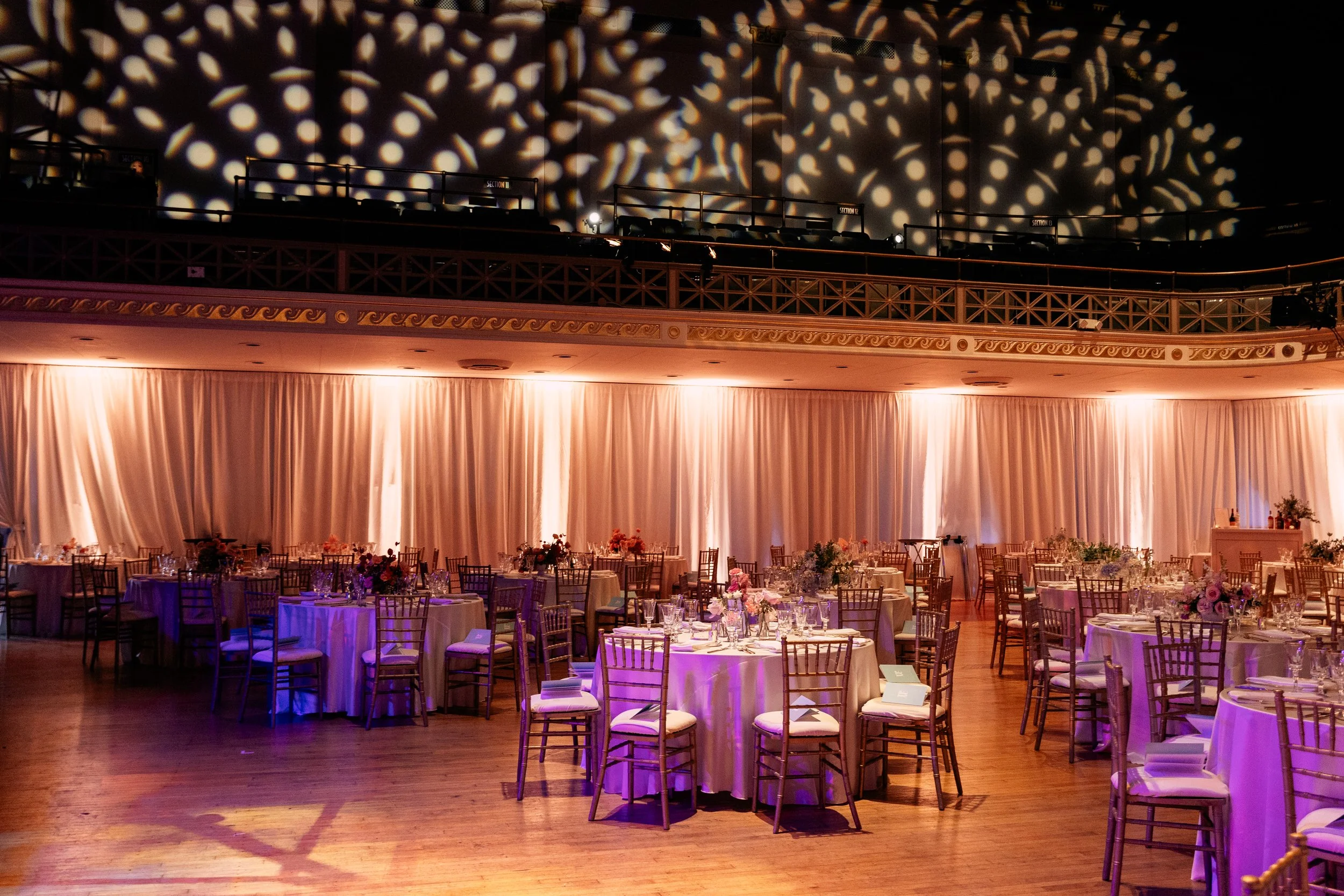 Modern and colorful centerpieces create a lively space for the TPAC Gala in Nashville, TN. Color-blocked floral hues of pink, red, yellow, blue comprised of roses, hydrangeas, tulips, ranunculus, pampas grass, carnations, and sweet peas. Designed by