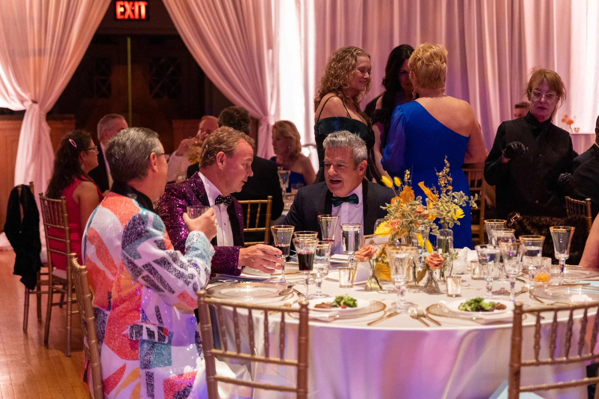 Modern and colorful centerpieces create a lively space for the TPAC Gala in Nashville, TN. Color-blocked floral hues of pink, red, yellow, blue comprised of roses, hydrangeas, tulips, ranunculus, pampas grass, carnations, and sweet peas. Designed by