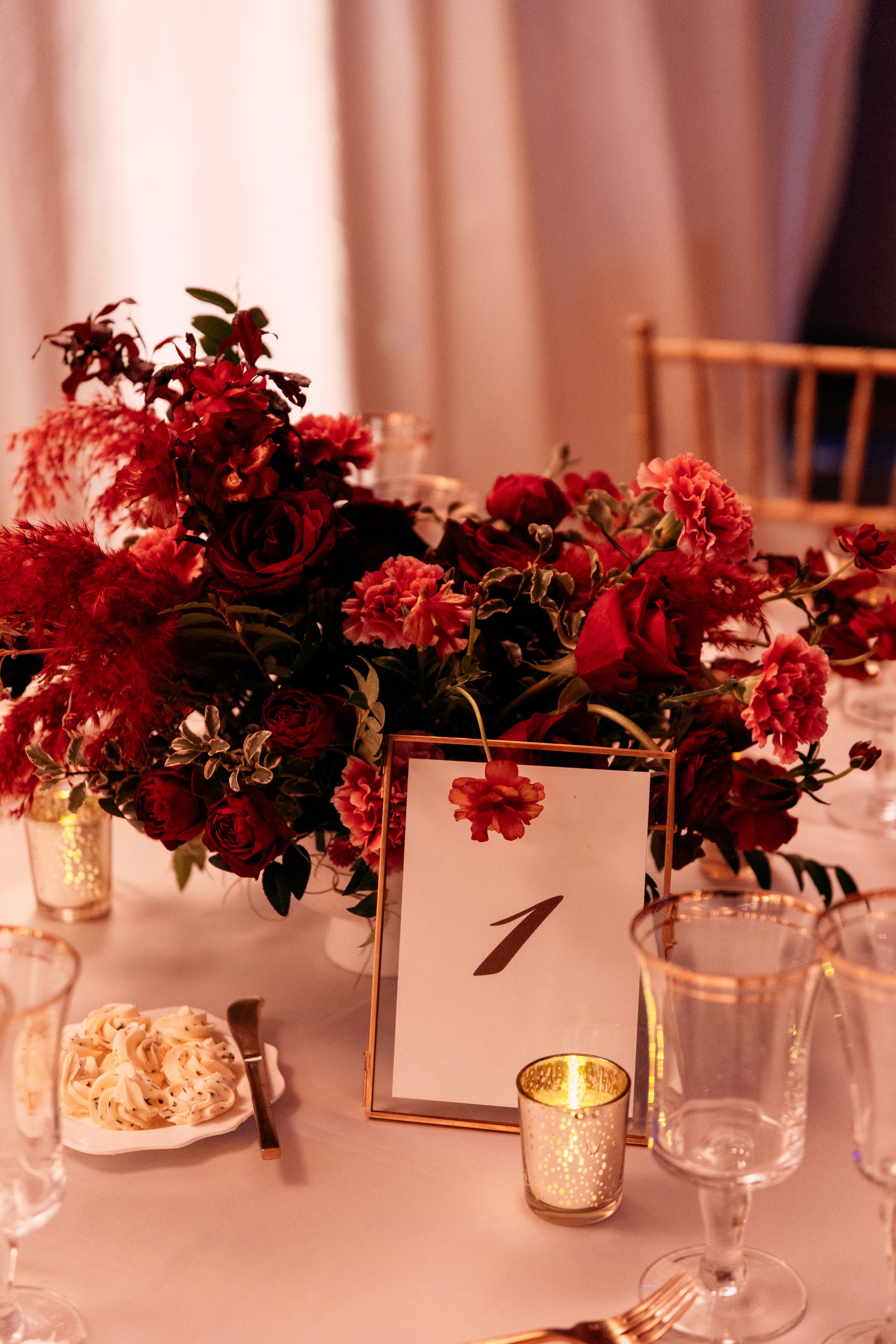 Modern and colorful centerpieces create a lively space for the TPAC Gala in Nashville, TN. Color-blocked floral hues of pink, red, yellow, blue comprised of roses, hydrangeas, tulips, ranunculus, pampas grass, carnations, and sweet peas. Designed by