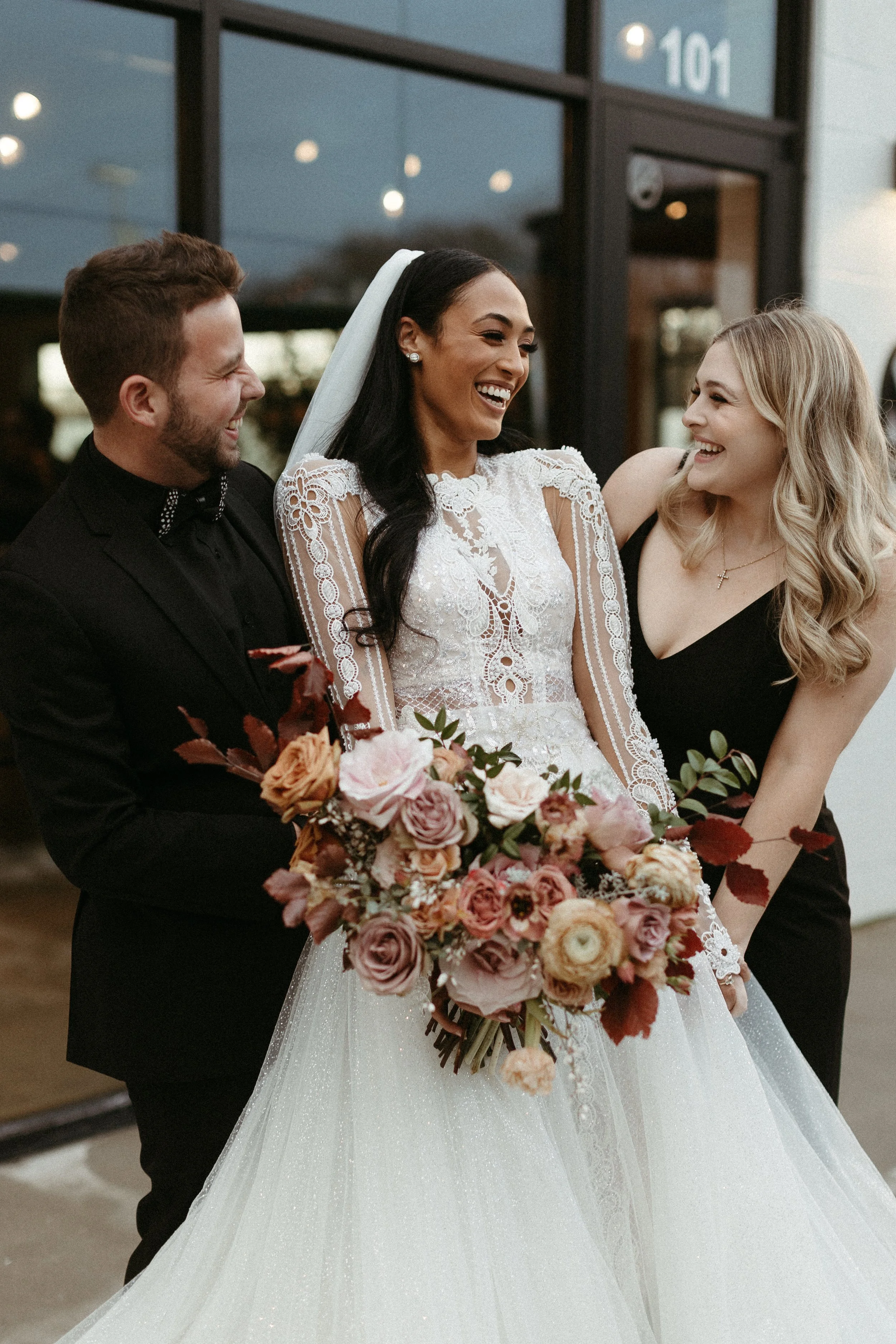 This elegant bridal bouquet brought hues of mauve, dusty pink, cream, burgundy, and terra cotta to this winter wedding. Lush with petal heavy roses, ranunculus, spray roses, copper beech, and greenery. Designed by Rosemary and Finch in Nashville, TN.