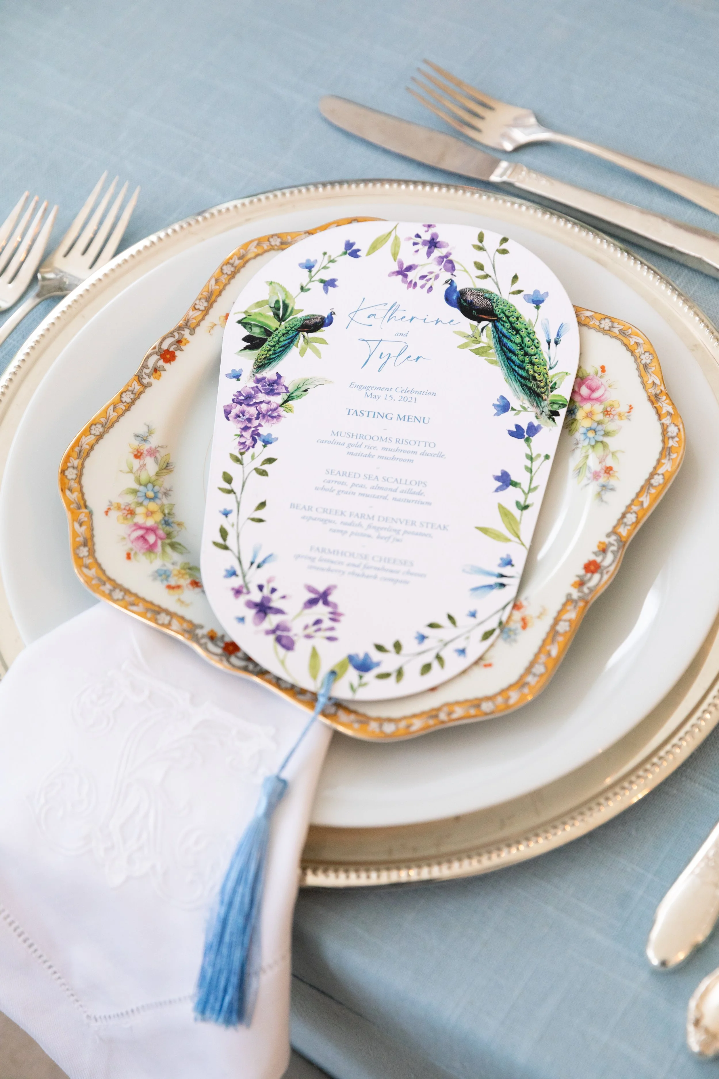 Growing, fresh floral centerpieces with blush garden roses, lilac, blue sweet peas, ranunculus, lavender delphinium, globe allium, and natural greenery for a tented Bridgerton inspired engagement party at a private home in Nashville, TN. Flower by Te