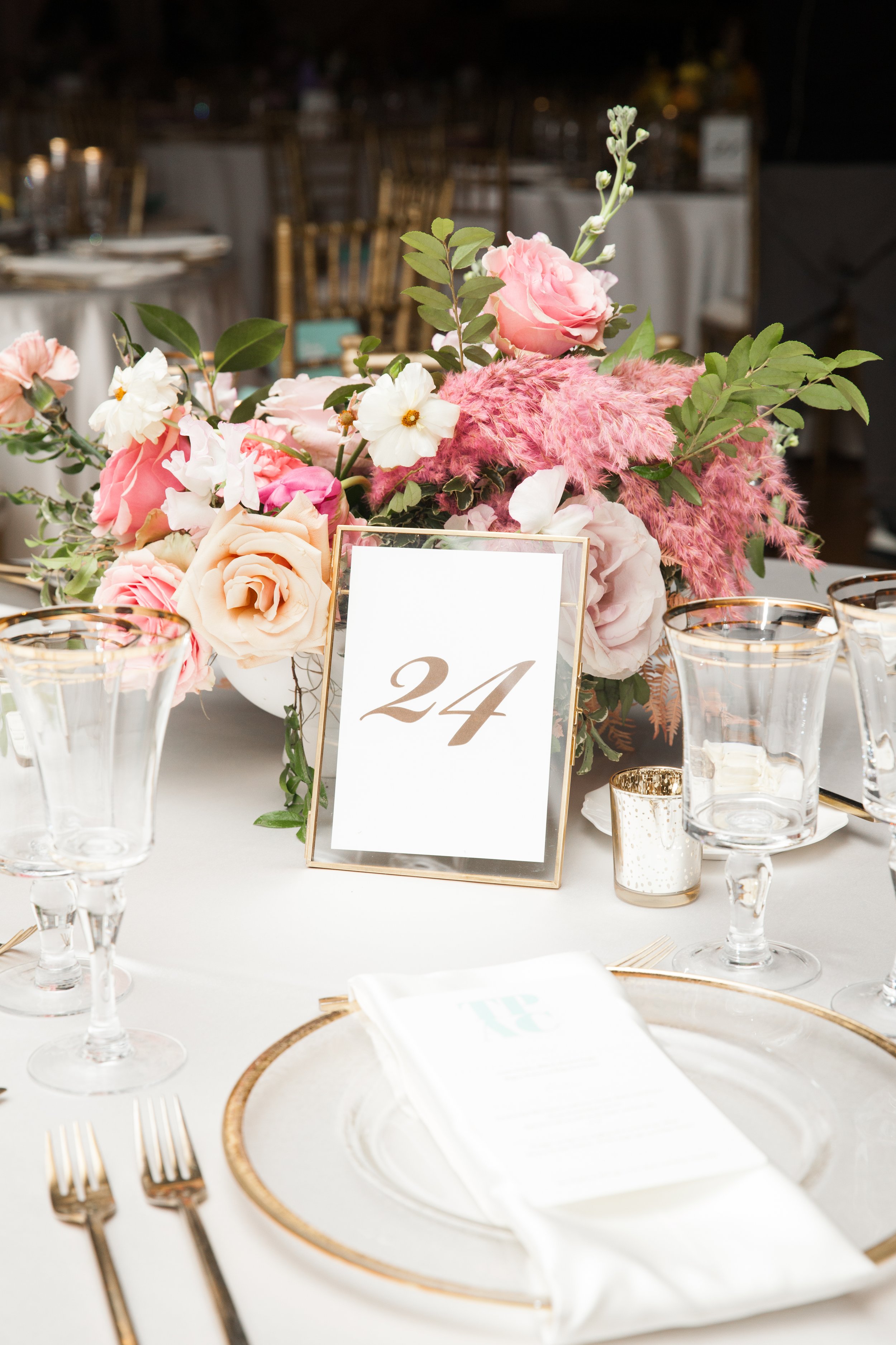 Modern and colorful centerpieces create a lively space for the TPAC Gala in Nashville, TN. Color-blocked floral hues of pink, red, yellow, blue comprised of roses, hydrangeas, tulips, ranunculus, pampas grass, carnations, and sweet peas. Designed by