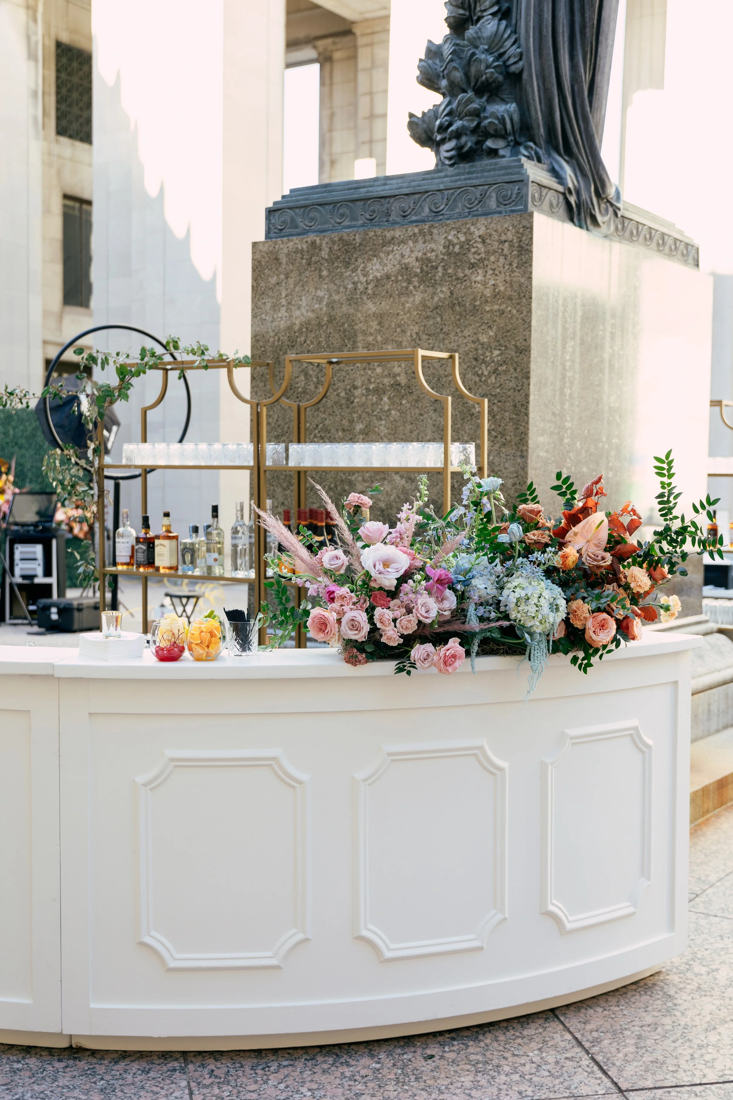 Bright and colorful arrangements create an inviting scene for guests at the TPAC Gala in Nashville Tennessee. Florals composed of roses, hydrangeas, tulips, snapdragons, dried palm, and anthurium. Designed by Rosemary and Finch.